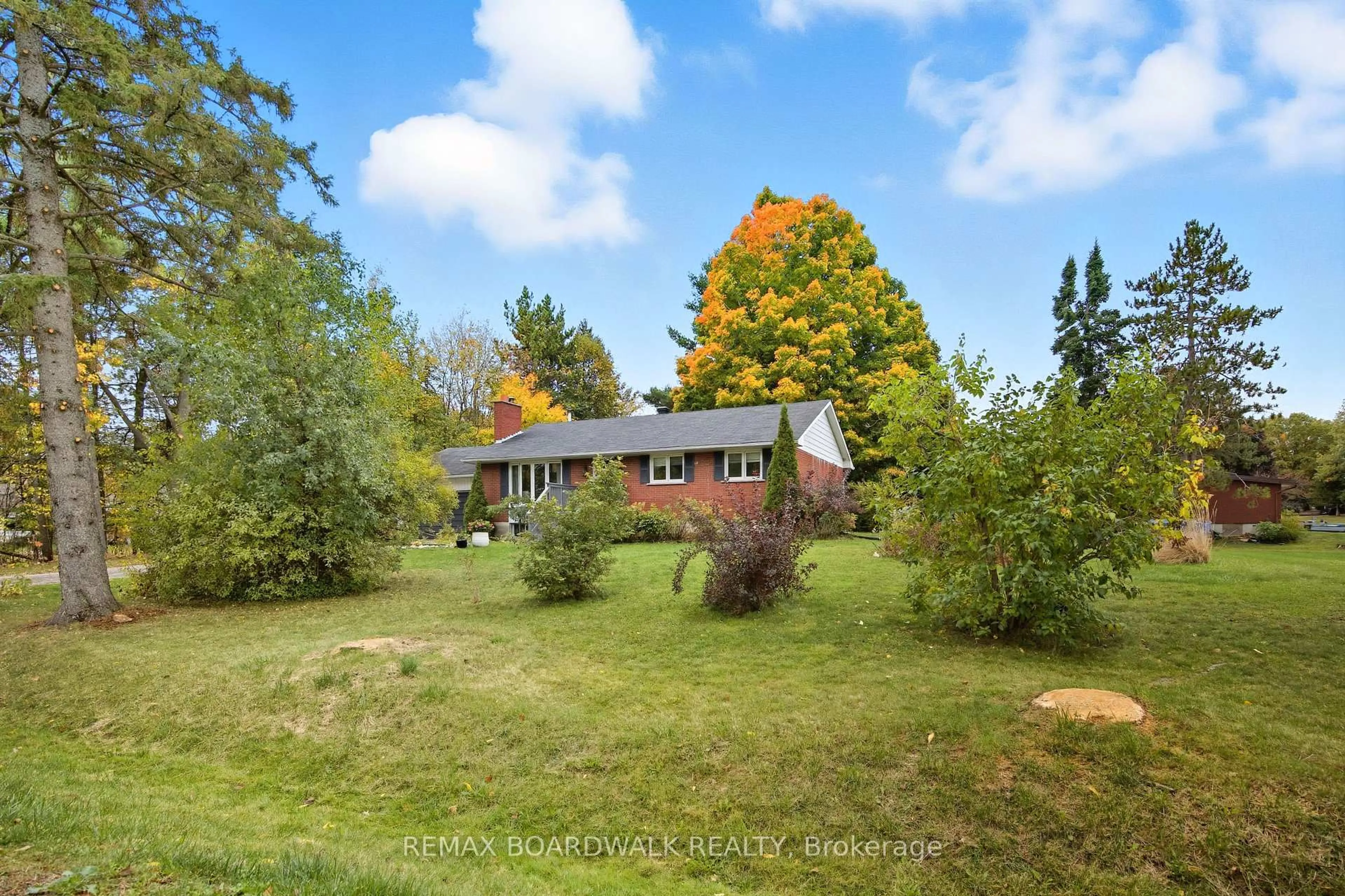 A pic from outside/outdoor area/front of a property/back of a property/a pic from drone, forest/trees view for 121 Stamford Dr, Perth Ontario K7H 3C1