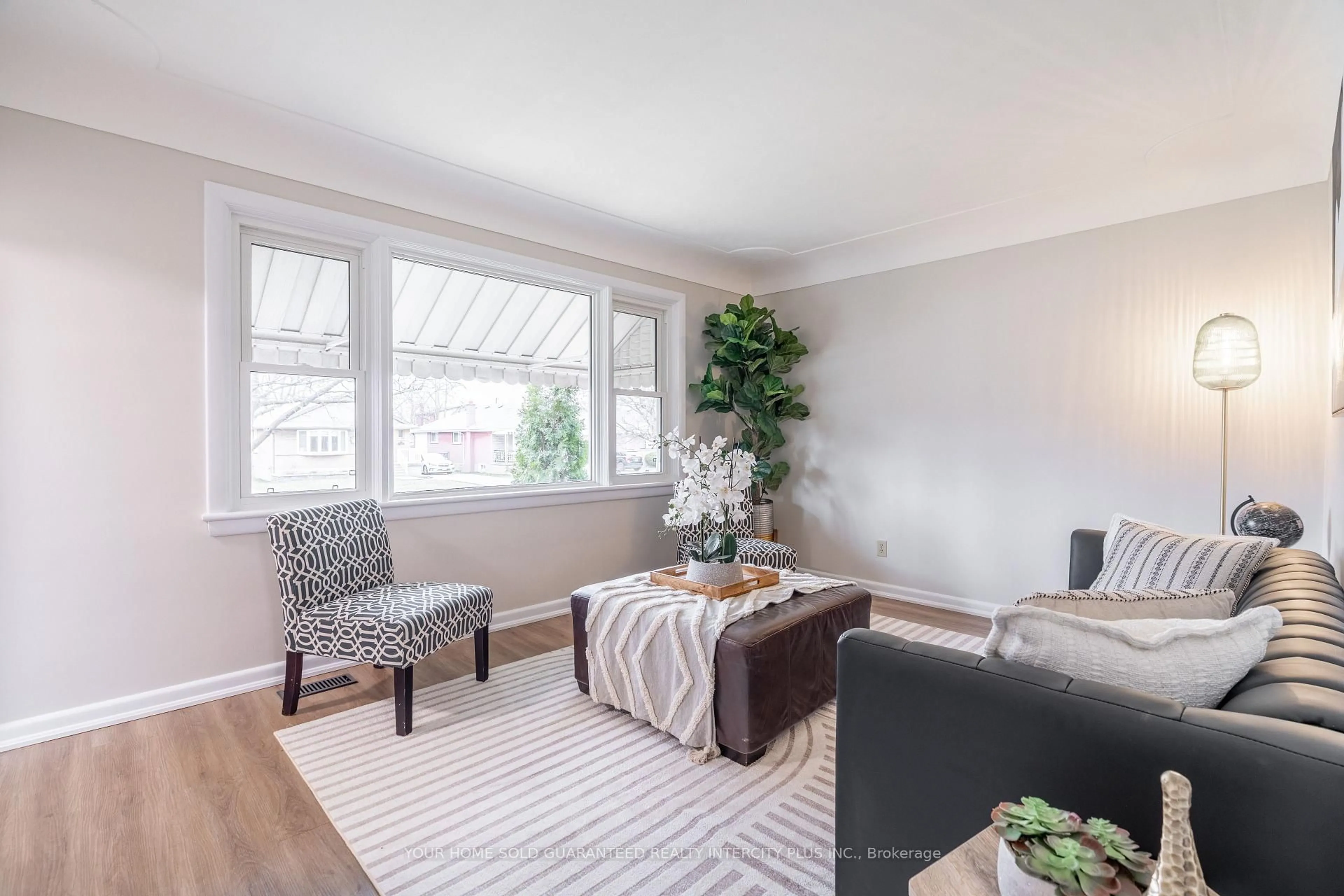 Living room with furniture, wood/laminate floor for 65 David Ave, Hamilton Ontario L9A 3V2