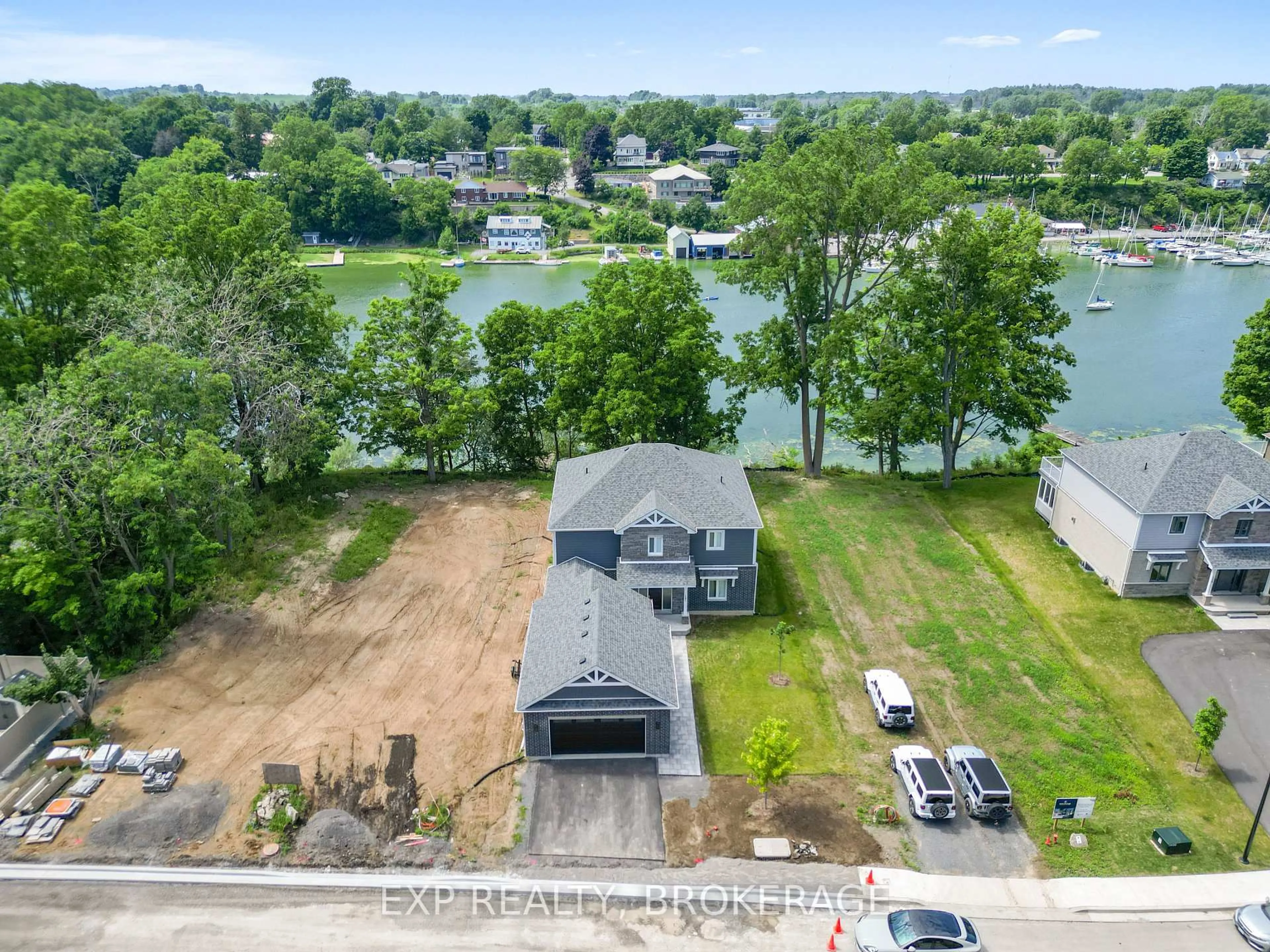 A pic from outside/outdoor area/front of a property/back of a property/a pic from drone, water/lake/river/ocean view for 101 VILLENEUVE Dr, Prince Edward County Ontario K0K 2T0