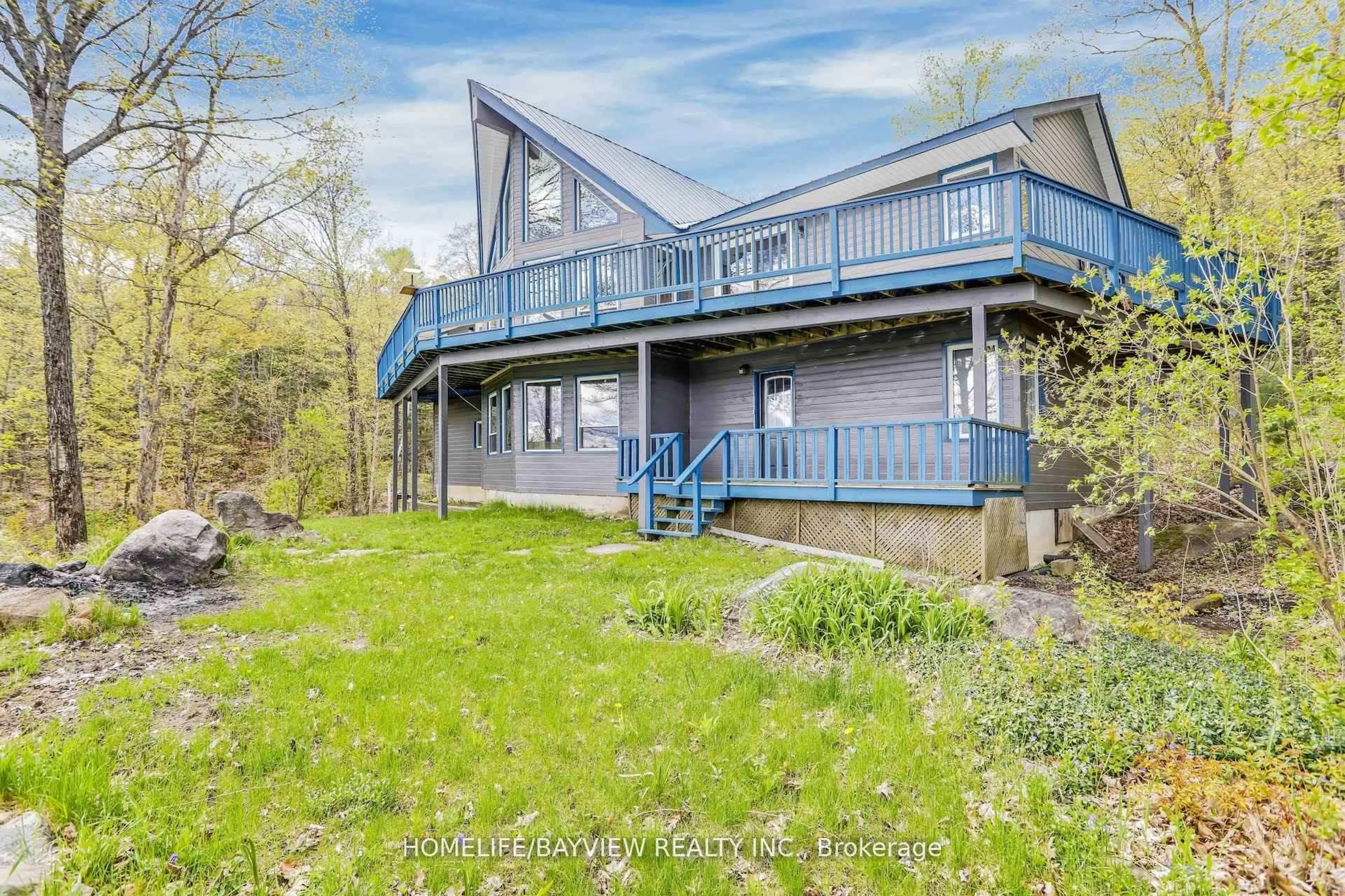 A pic from outside/outdoor area/front of a property/back of a property/a pic from drone, water/lake/river/ocean view for 19243 Hwy 35 Highway, Algonquin Highlands Ontario K0M 1J2