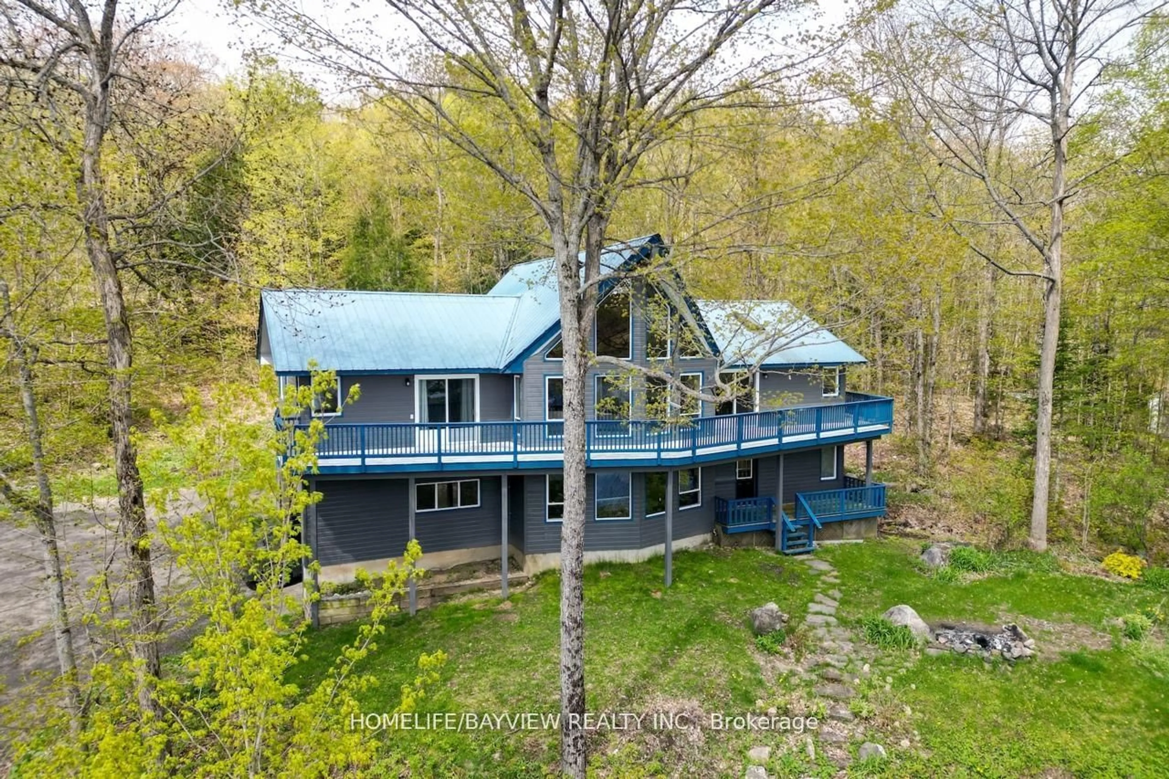 A pic from outside/outdoor area/front of a property/back of a property/a pic from drone, water/lake/river/ocean view for 19243 Hwy 35 Highway, Algonquin Highlands Ontario K0M 1J2