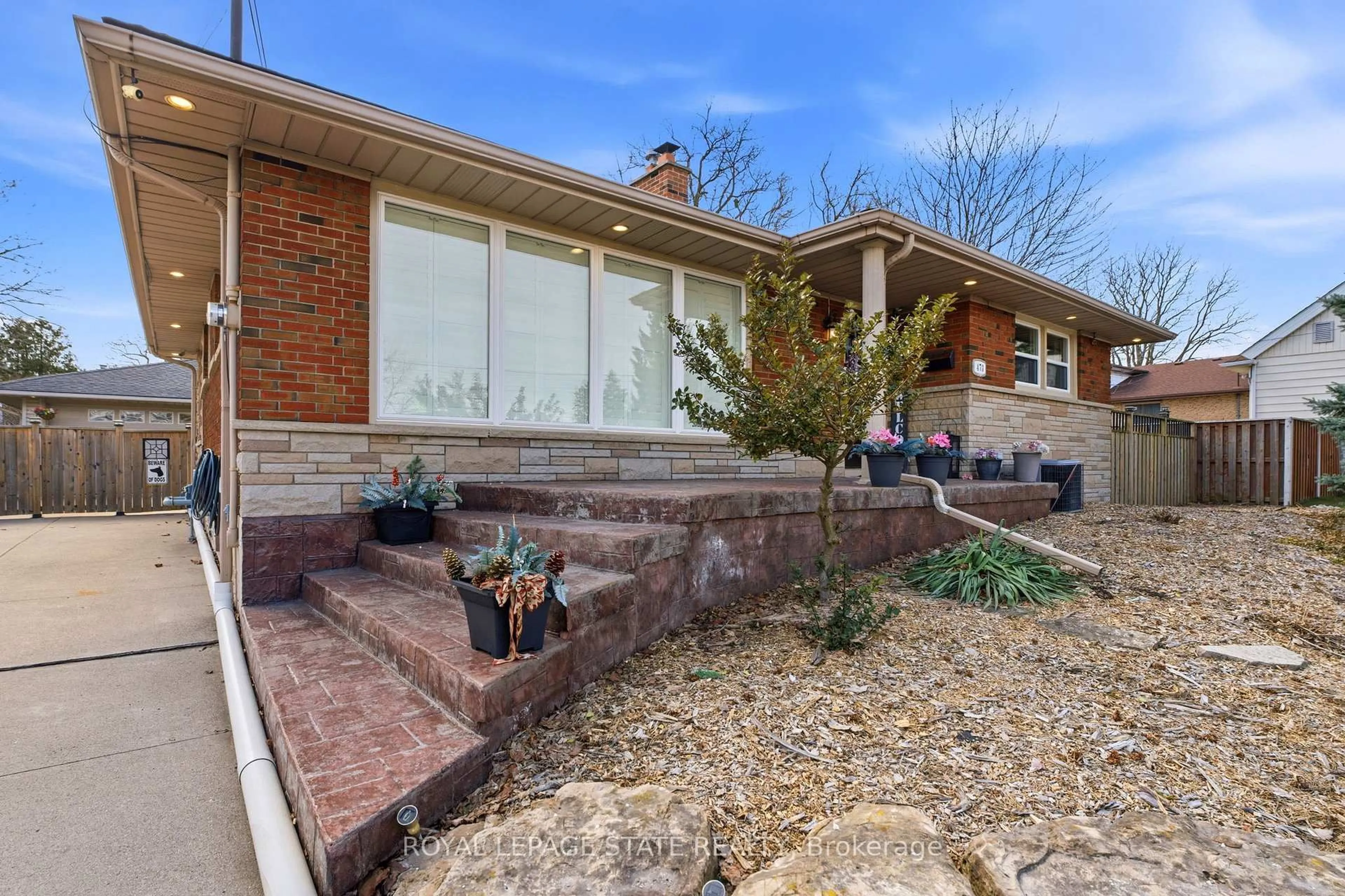 Home with brick exterior material, street for 473 Mohawk Rd, Hamilton Ontario L9C 1X3