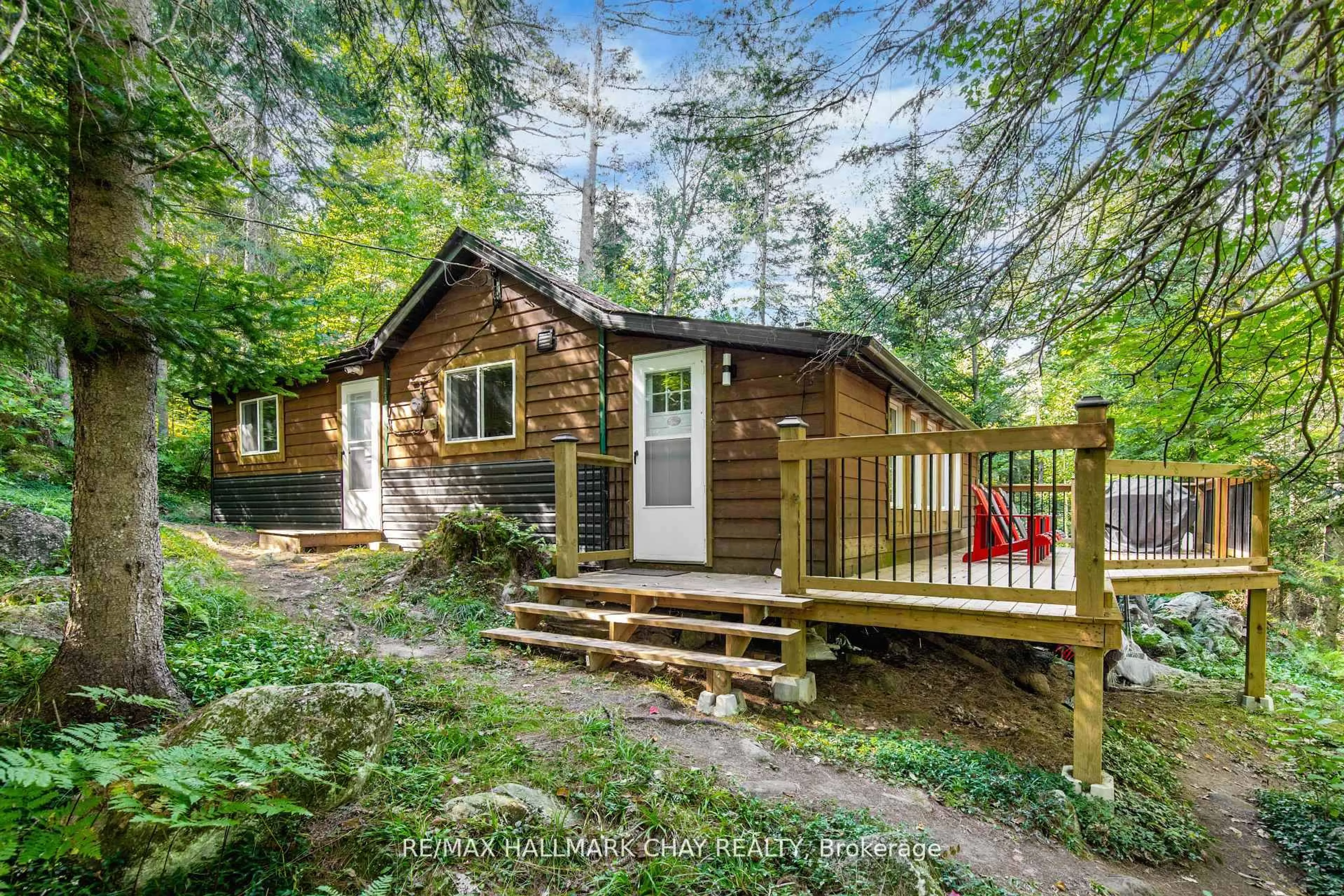 A pic from outside/outdoor area/front of a property/back of a property/a pic from drone, forest/trees view for 182 Brodie Kay Tr, Huntsville Ontario P0B 1L0