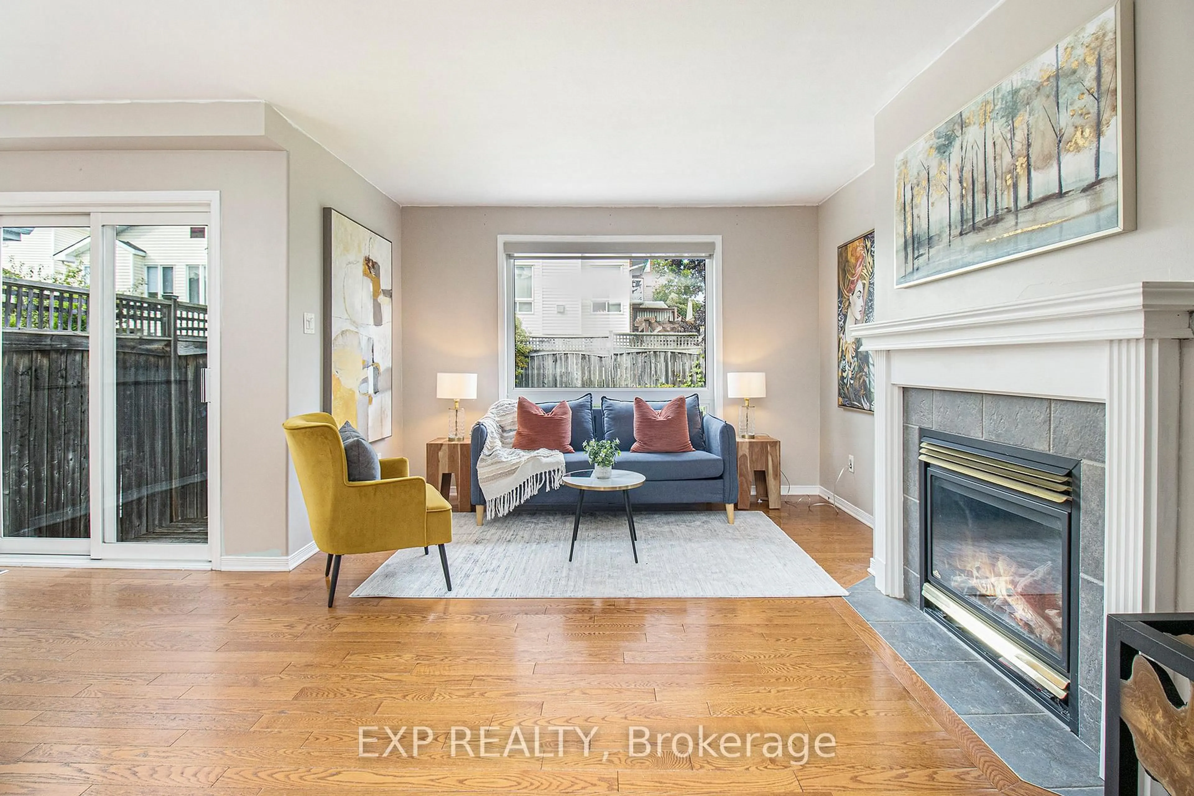 Living room with furniture, wood/laminate floor for 1310 Halton Terr, Ottawa Ontario K2K 3K6