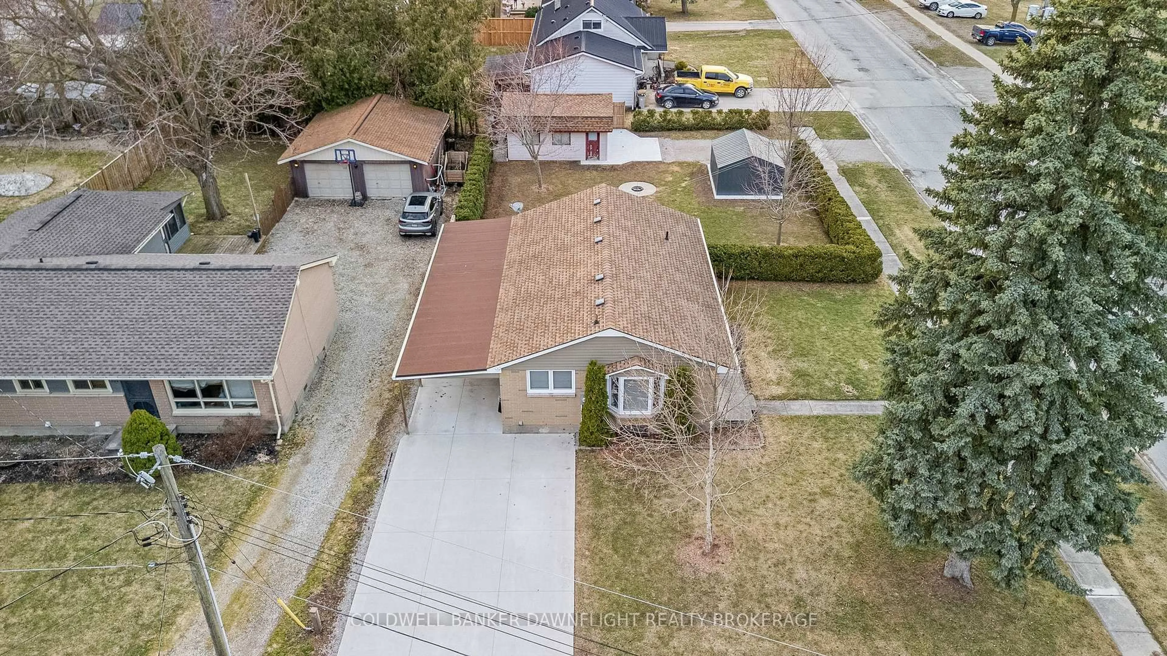 A pic from outside/outdoor area/front of a property/back of a property/a pic from drone, street for 105 Wellington St, South Huron Ontario N0M 1S2