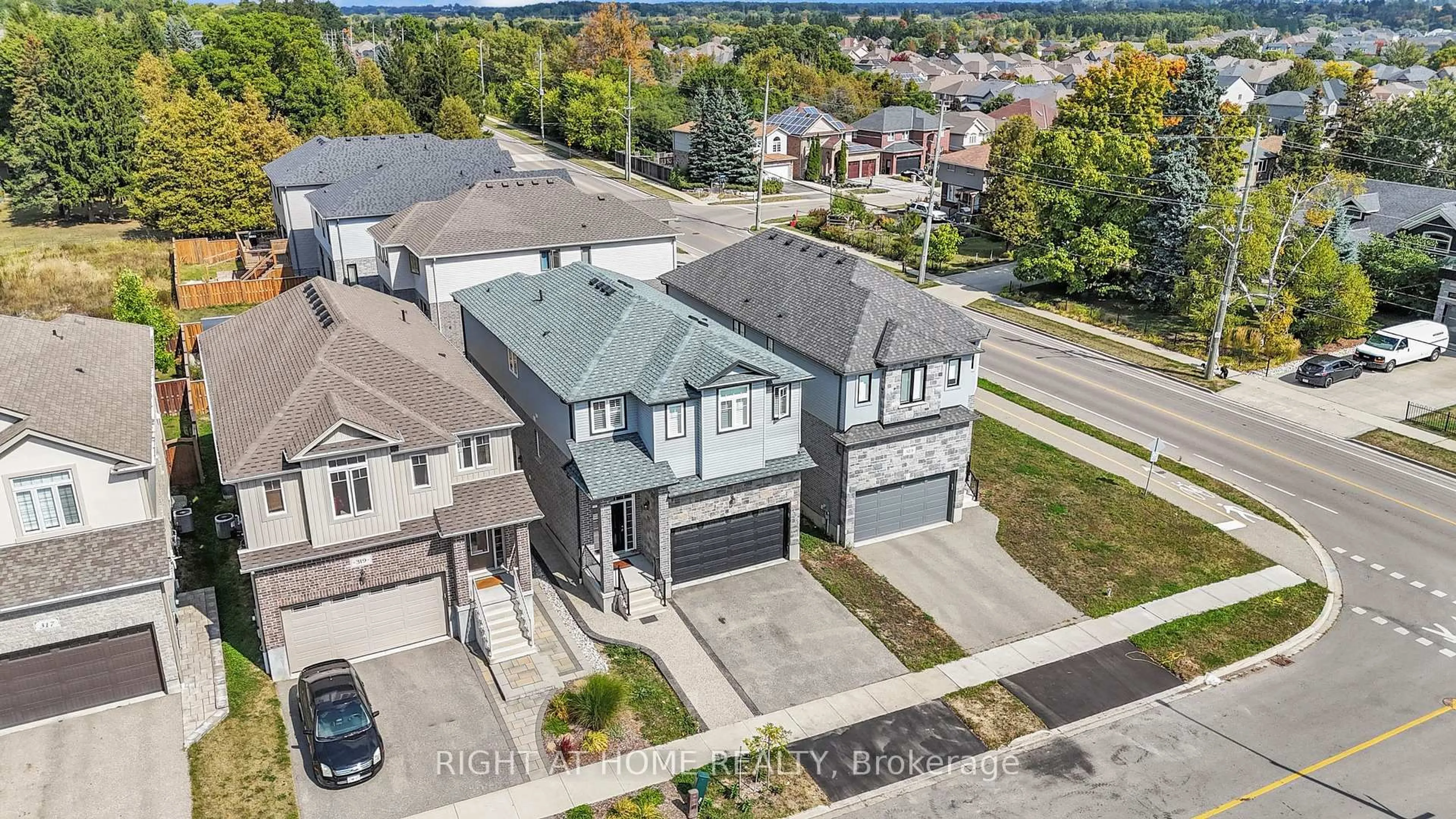 A pic from outside/outdoor area/front of a property/back of a property/a pic from drone, street for 321 Carriage Way, Waterloo Ontario N2K 0C2
