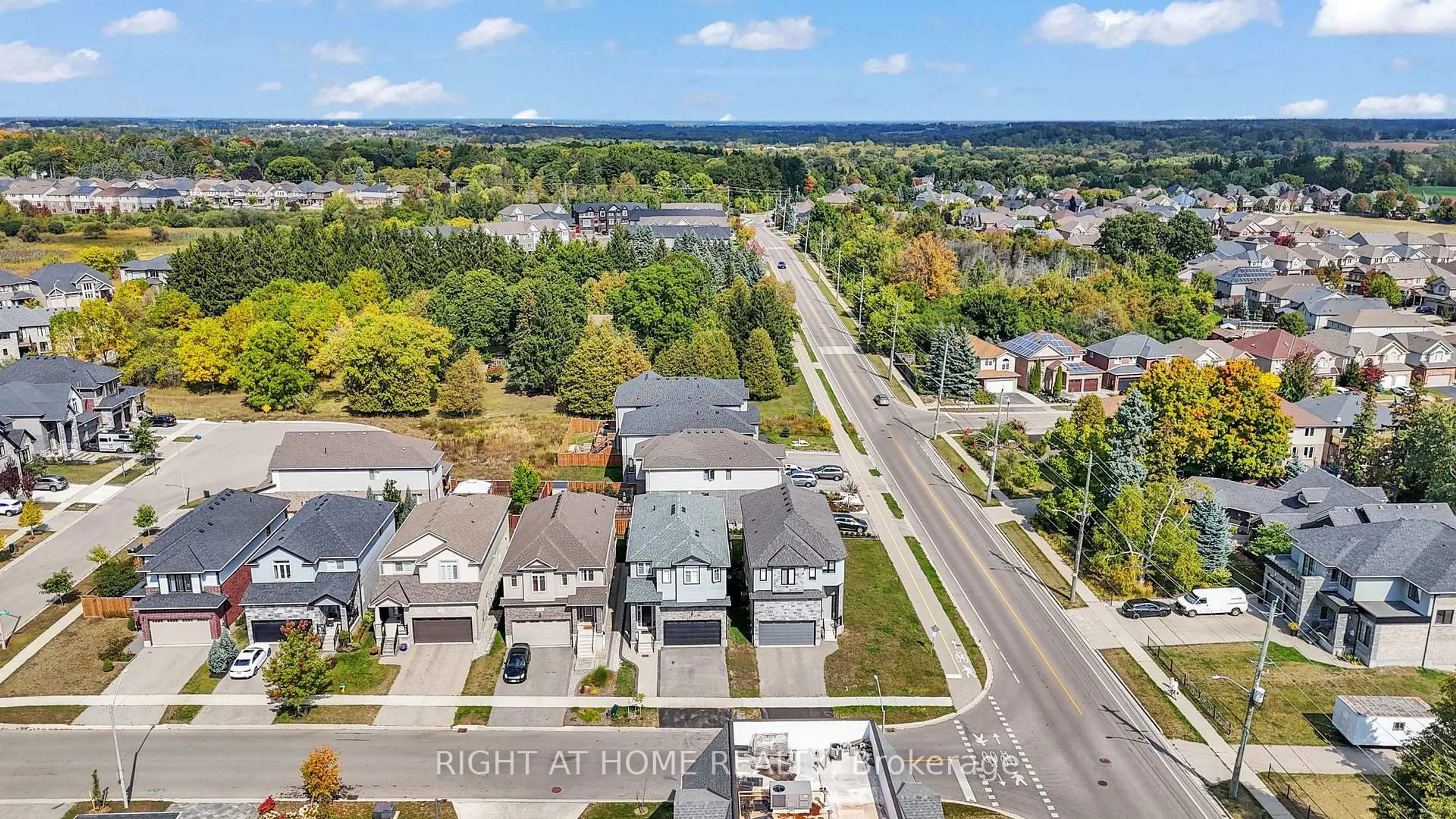 A pic from outside/outdoor area/front of a property/back of a property/a pic from drone, street for 321 Carriage Way, Waterloo Ontario N2K 0C2