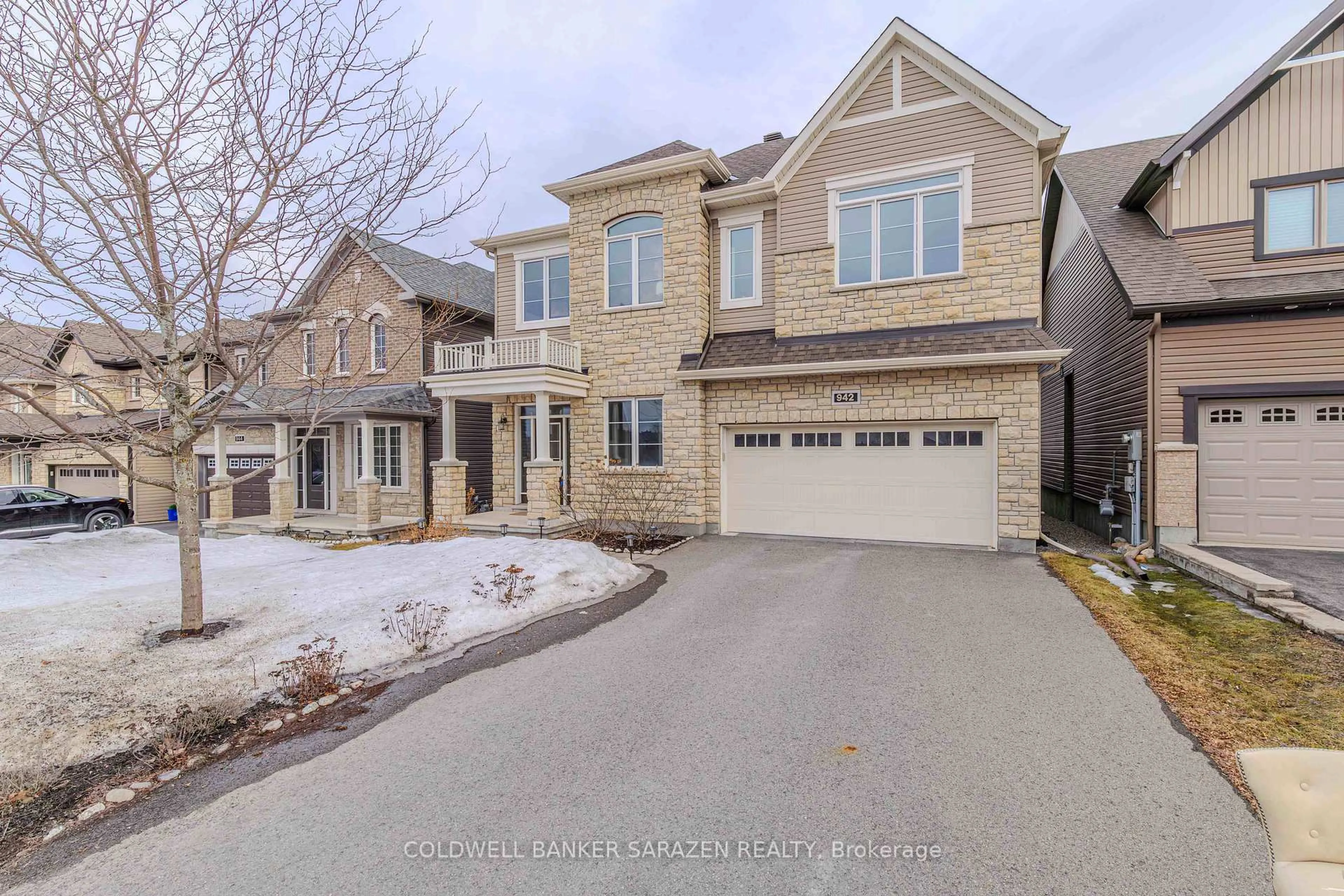 Home with brick exterior material, street for 942 Guinness Cres, Ottawa Ontario K2C 3H2