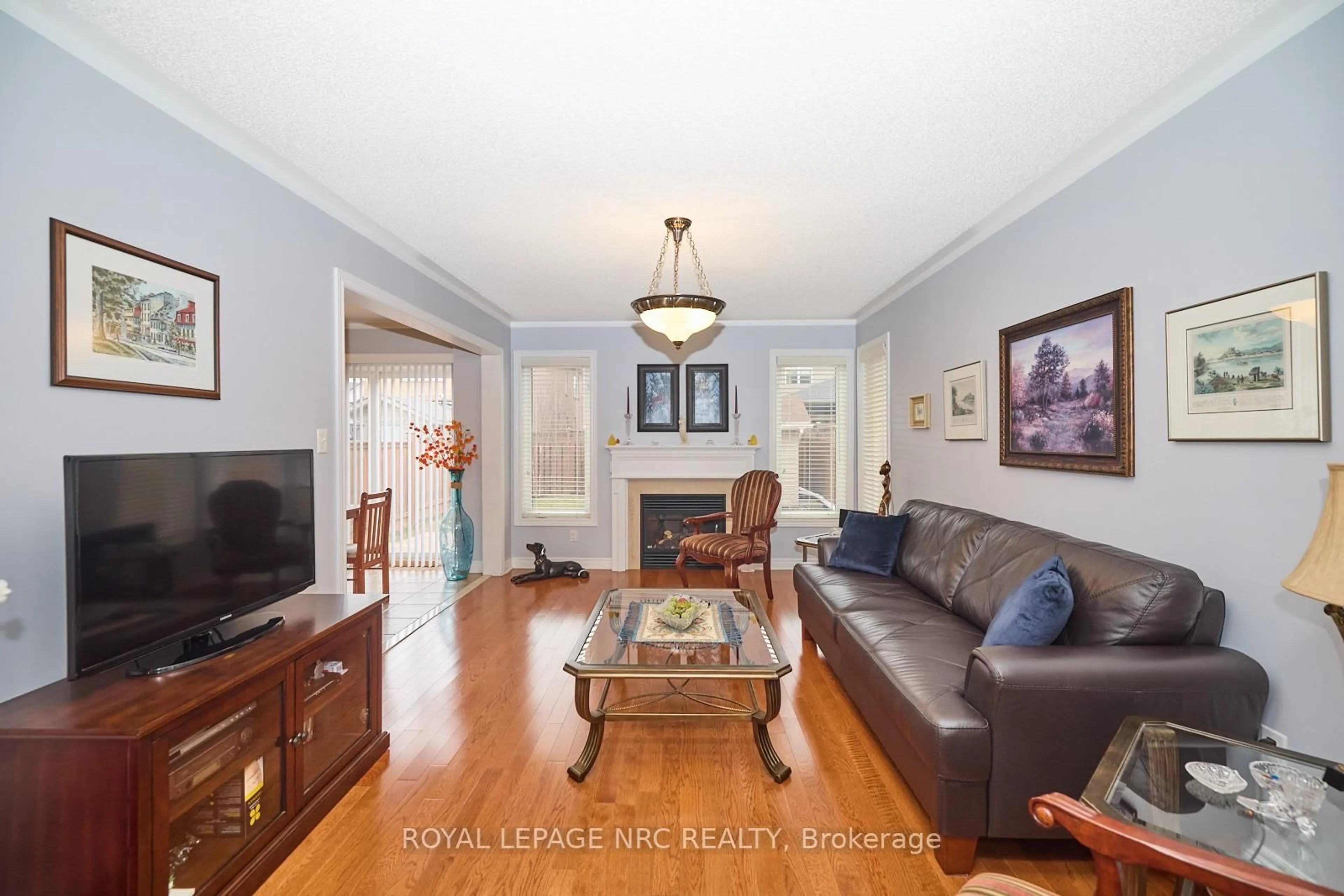 Living room with furniture, wood/laminate floor for 4 Alex Grant Pl, St. Catharines Ontario L2P 0A2