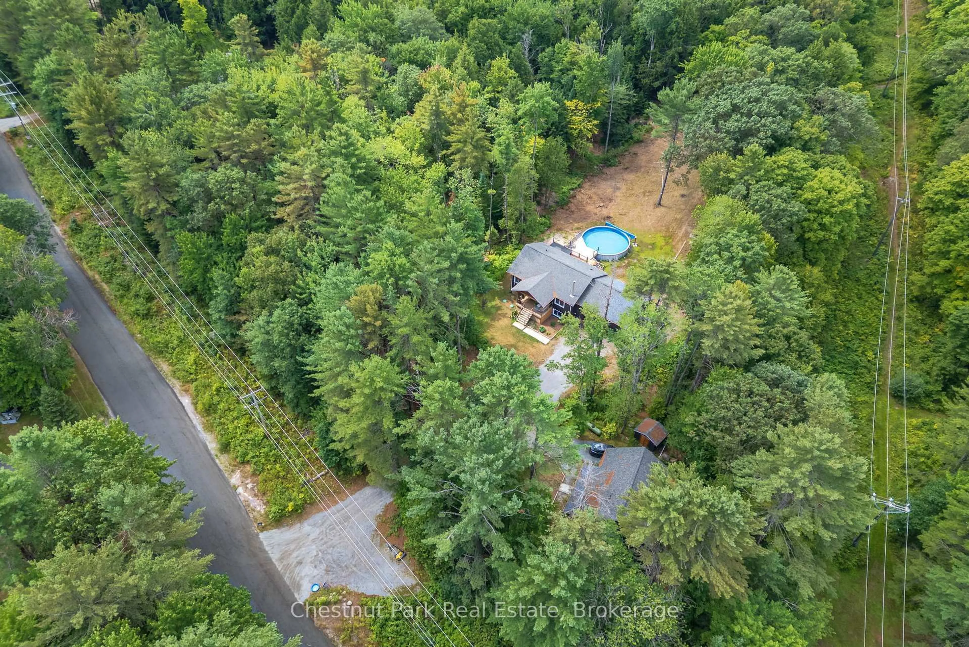 A pic from outside/outdoor area/front of a property/back of a property/a pic from drone, forest/trees view for 2698 Old Muskoka Rd, Huntsville Ontario P0B 1M0