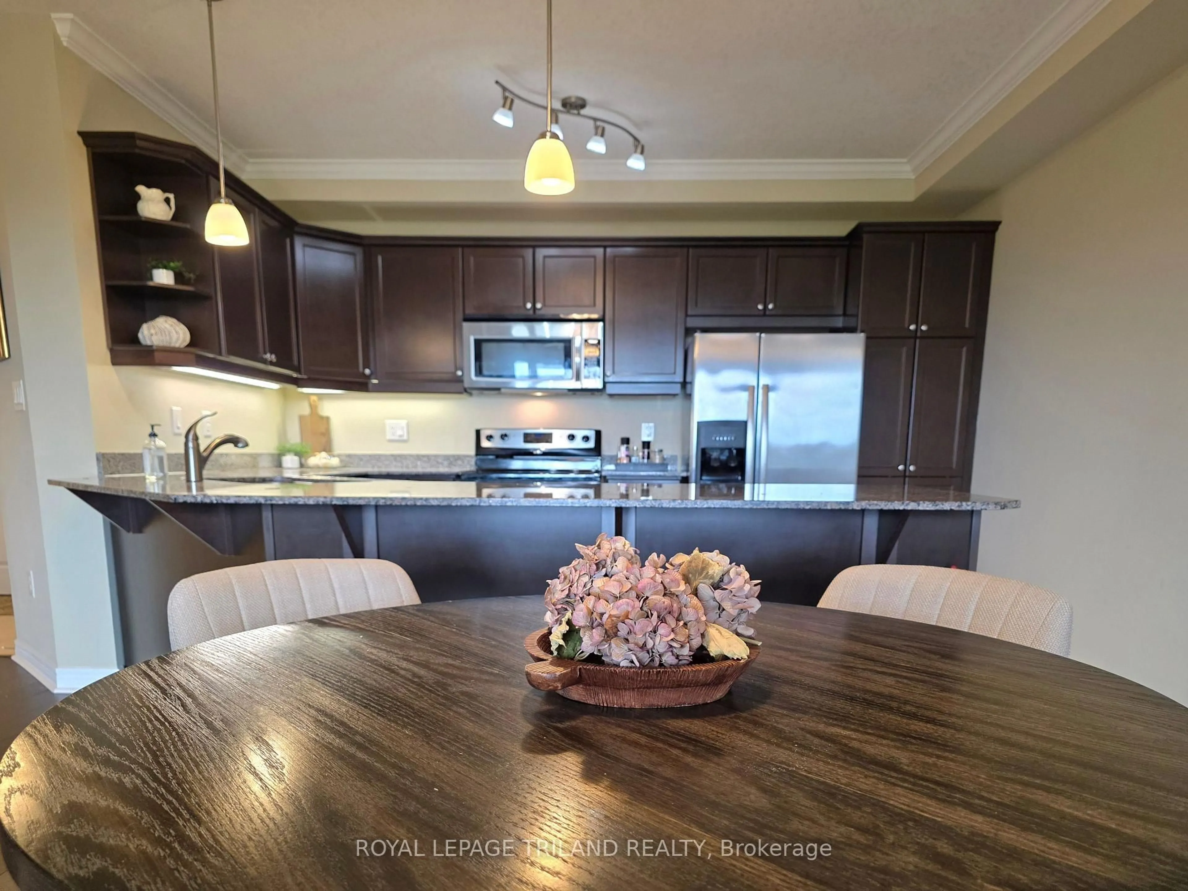 Open concept kitchen, wood/laminate floor for 1030 Coronation Dr #406, London North Ontario N6G 0G5