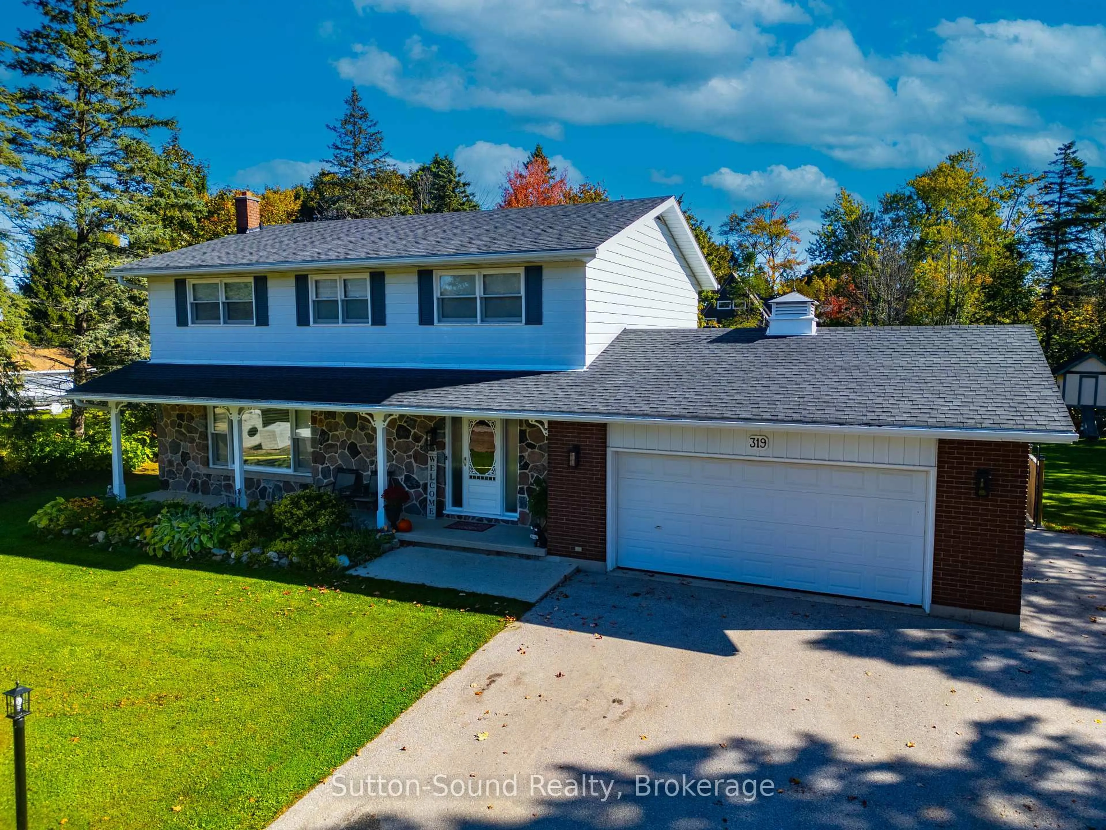 A pic from outside/outdoor area/front of a property/back of a property/a pic from drone, street for 319 Gould St, South Bruce Peninsula Ontario N0H 2T0