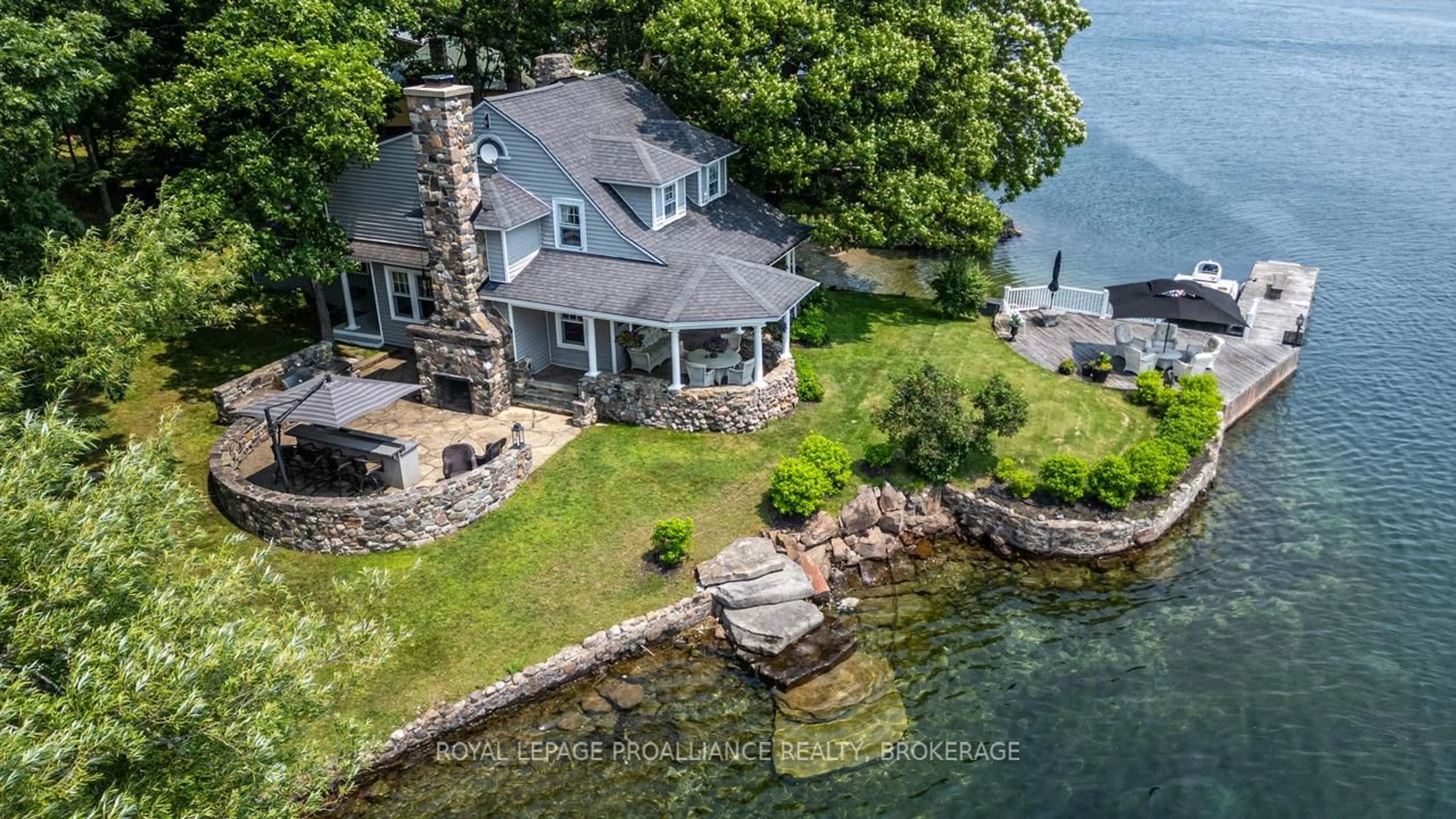 A pic from outside/outdoor area/front of a property/back of a property/a pic from drone, water/lake/river/ocean view for 121 Tremont Park Island, Frontenac Islands Ontario K7G 3C9