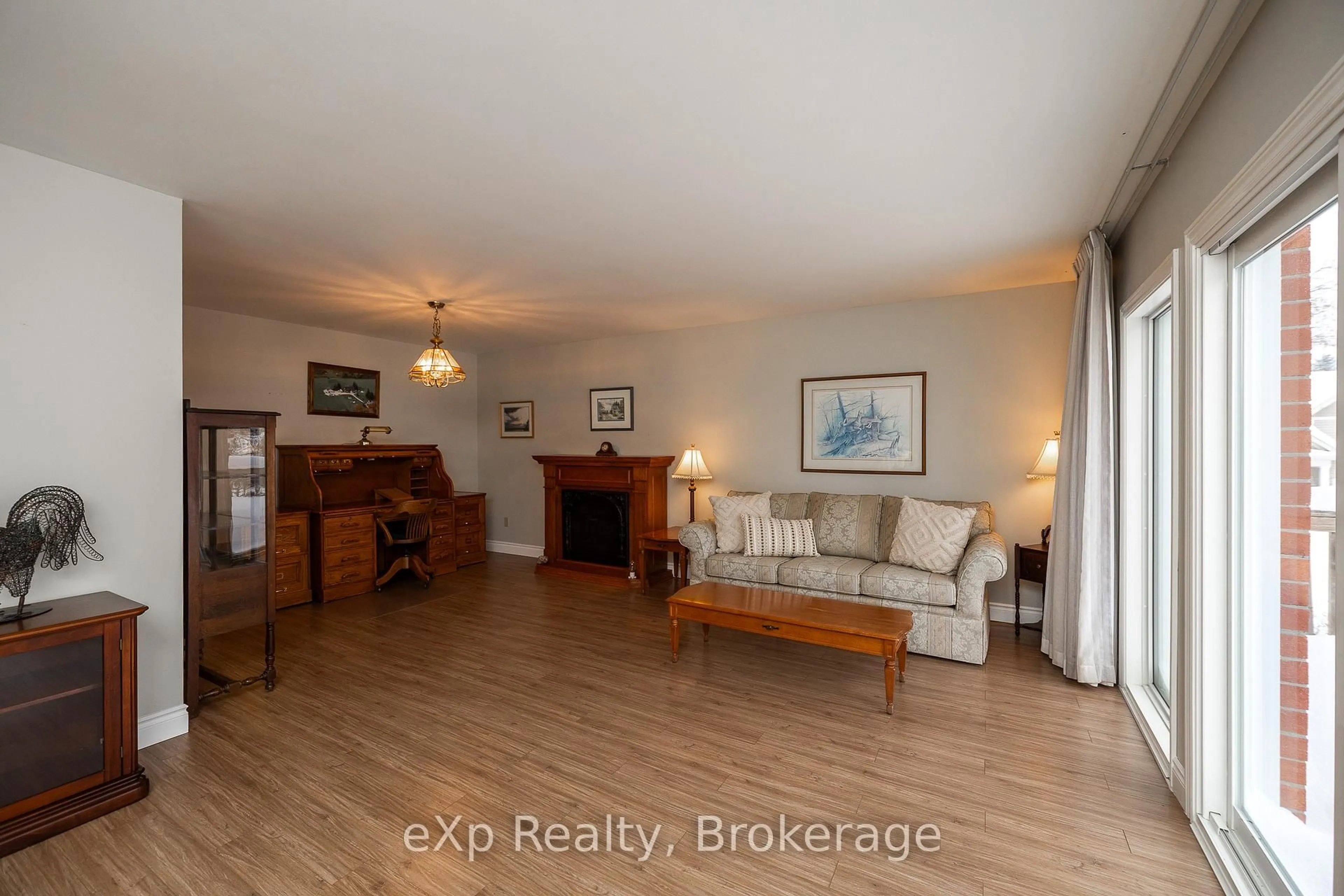 Living room with furniture, wood/laminate floor for 103 Margaret Elizabeth Ave, Grey Highlands Ontario N0C 1H0