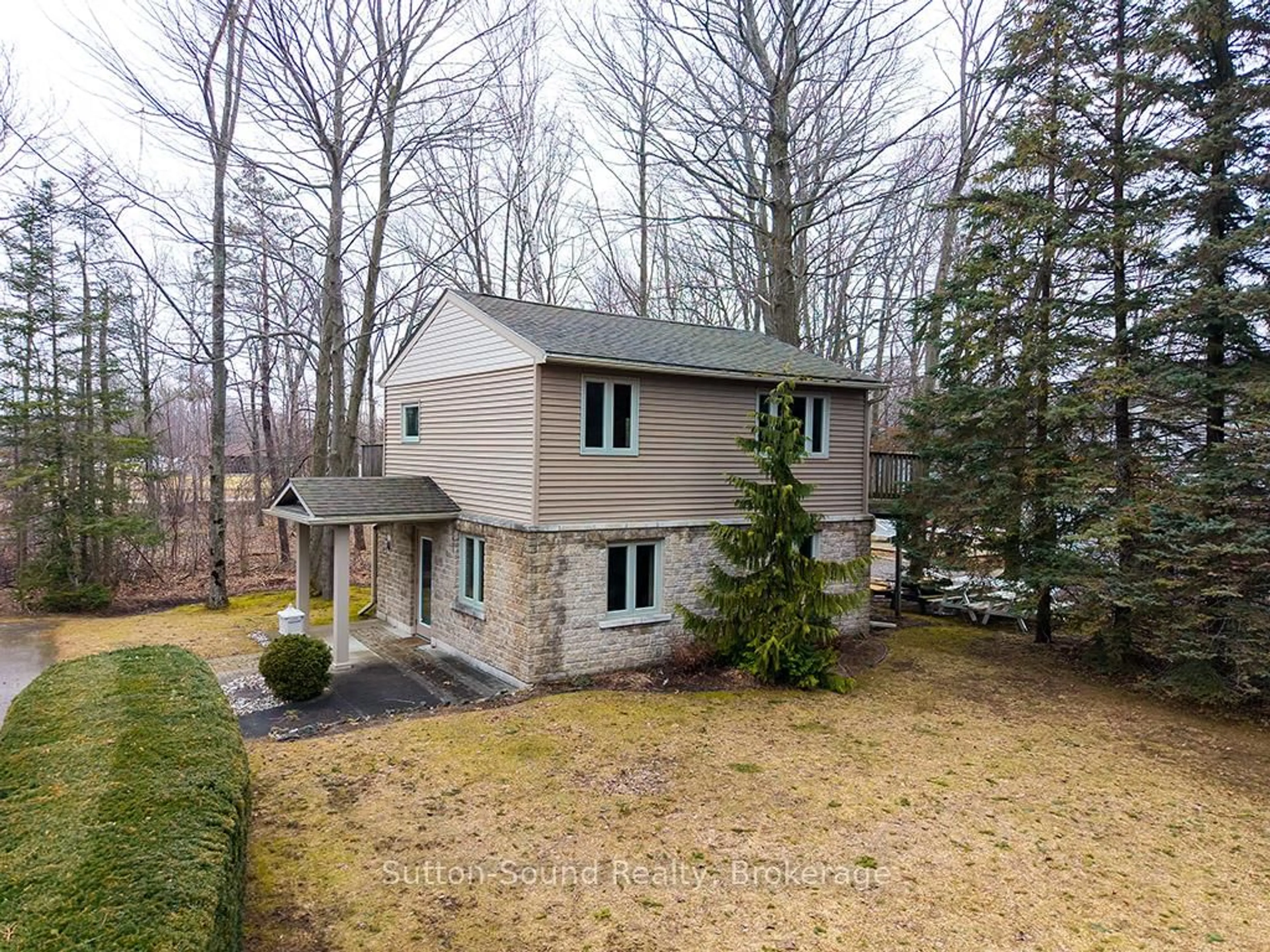 A pic from outside/outdoor area/front of a property/back of a property/a pic from drone, forest/trees view for 660 Main St, South Bruce Peninsula Ontario N0H 2T0