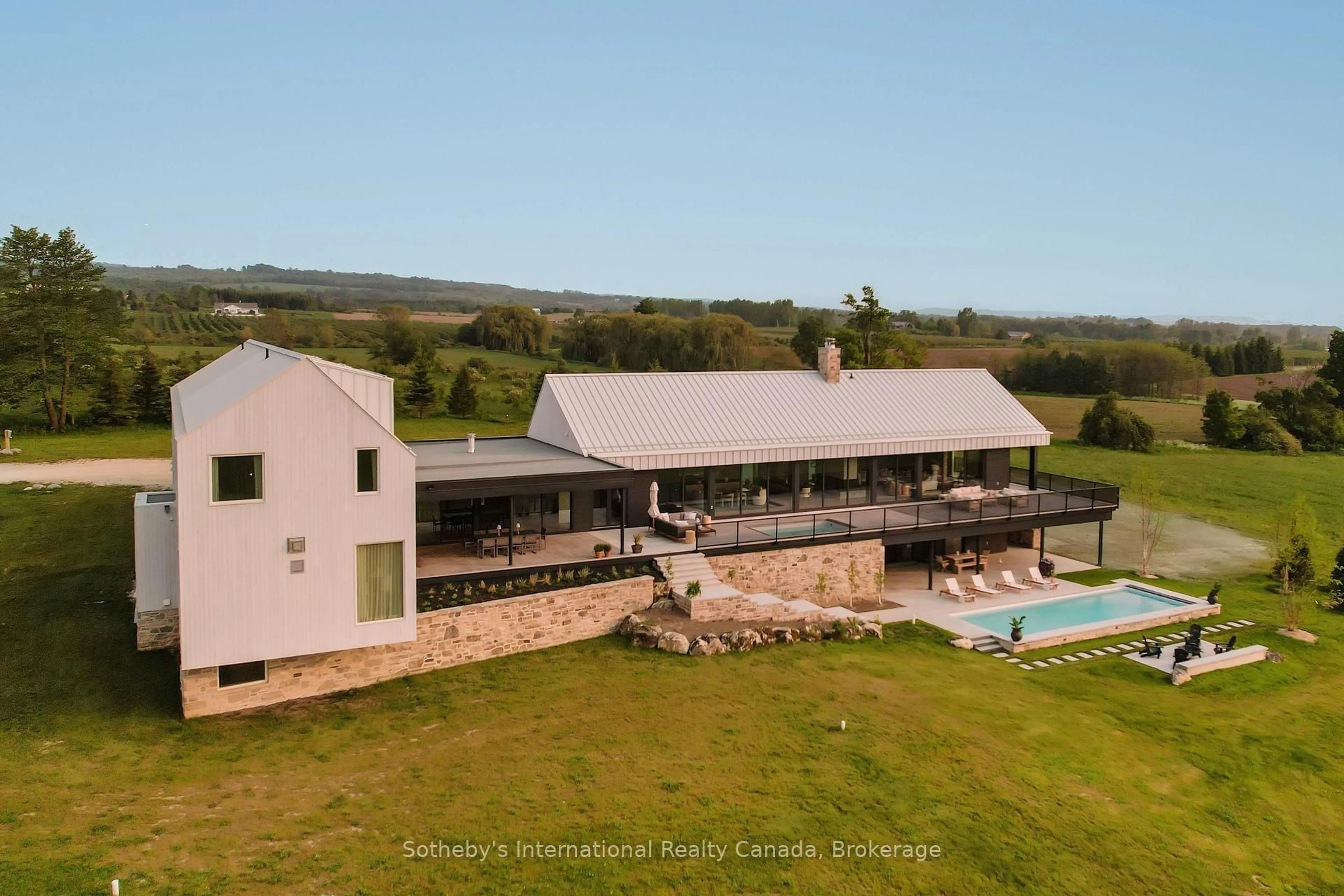 A pic from outside/outdoor area/front of a property/back of a property/a pic from drone, building for 516450 7th Line, Blue Mountains Ontario N0H 1J0