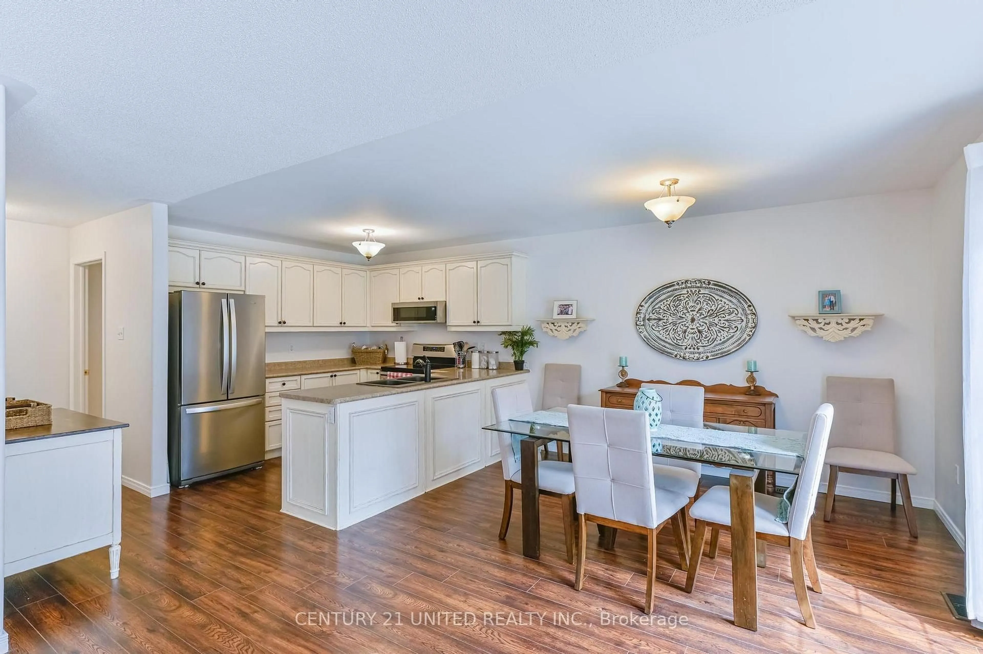 Open concept kitchen, wood/laminate floor for 833 Bertrand Terr, Peterborough Ontario K9K 2T1
