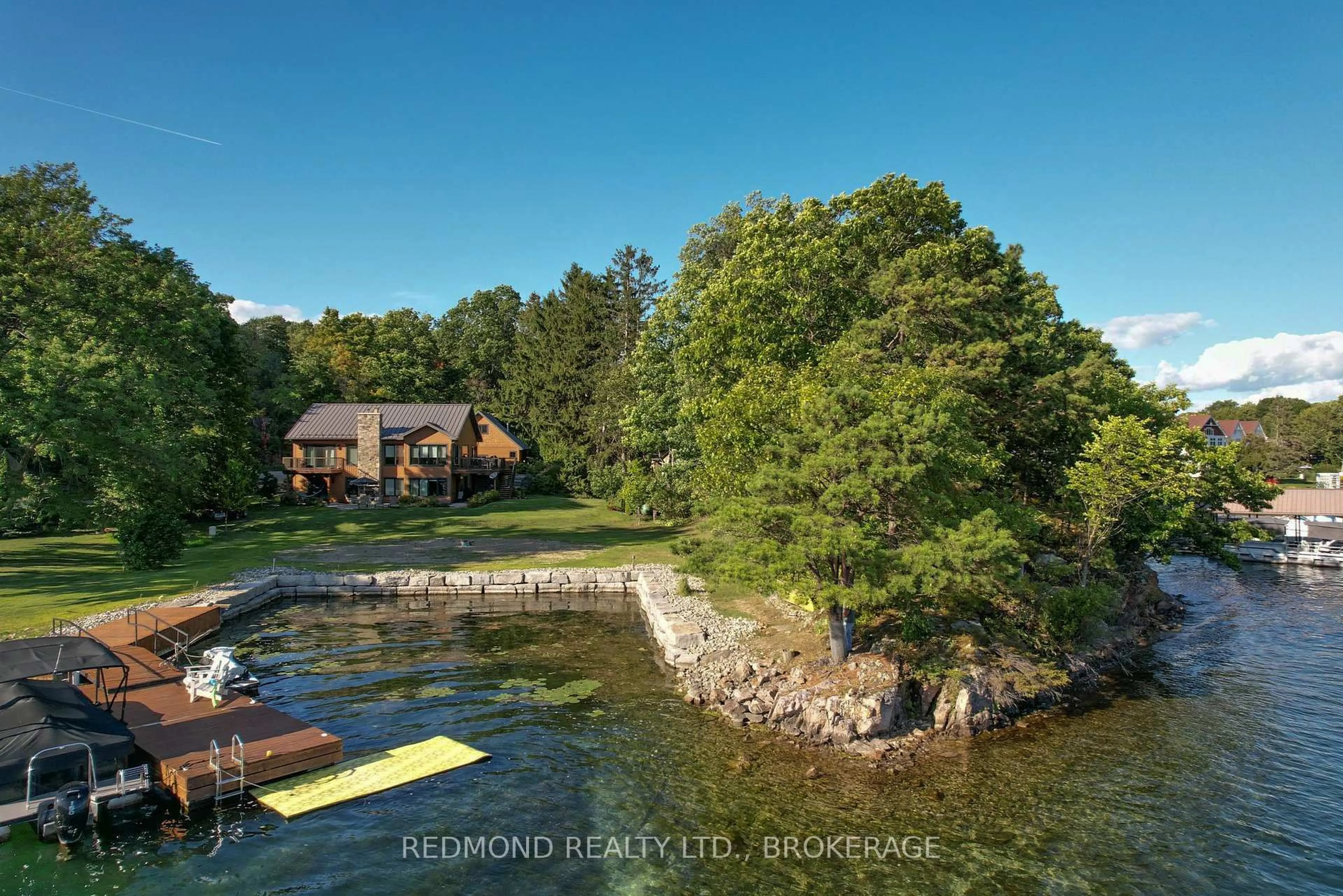 A pic from outside/outdoor area/front of a property/back of a property/a pic from drone, water/lake/river/ocean view for 403 Thousand Islands Pkwy, Lansdowne Ontario K0E 1L0