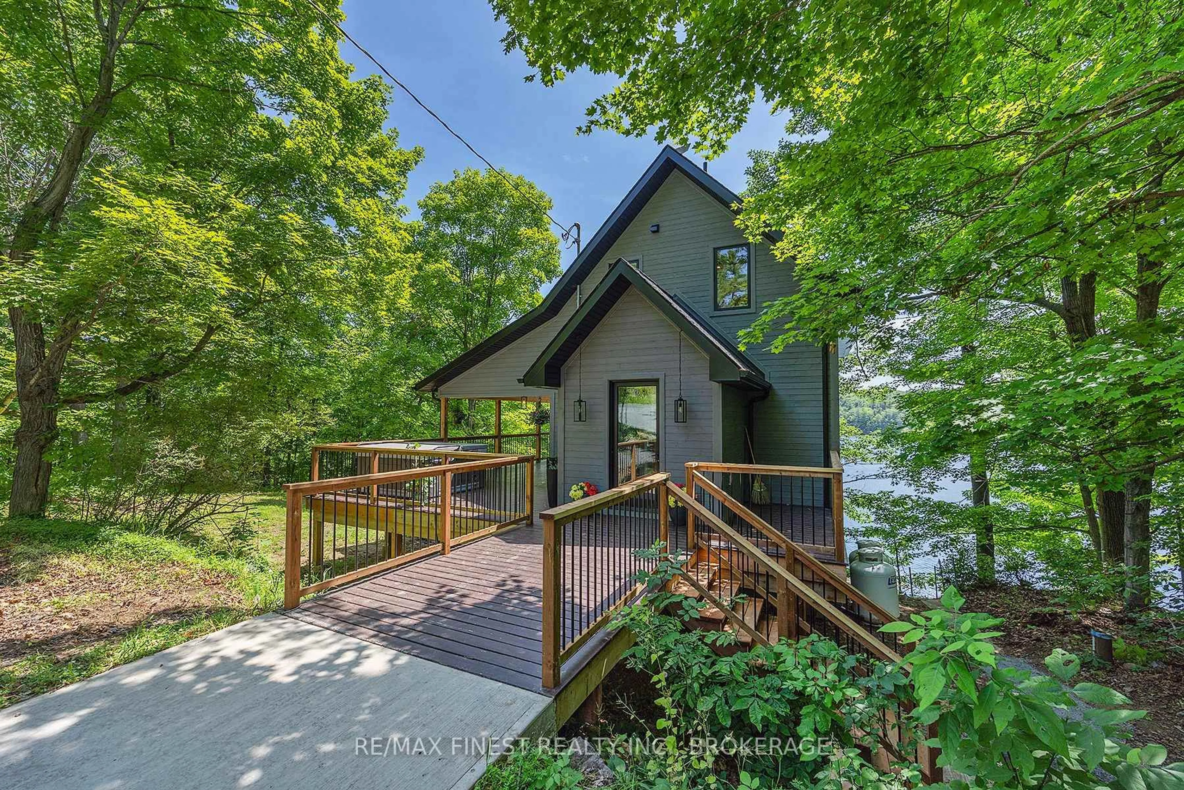 A pic from outside/outdoor area/front of a property/back of a property/a pic from drone, water/lake/river/ocean view for 1005 MacDonald Lane, Perth Road Ontario K0H 2L0