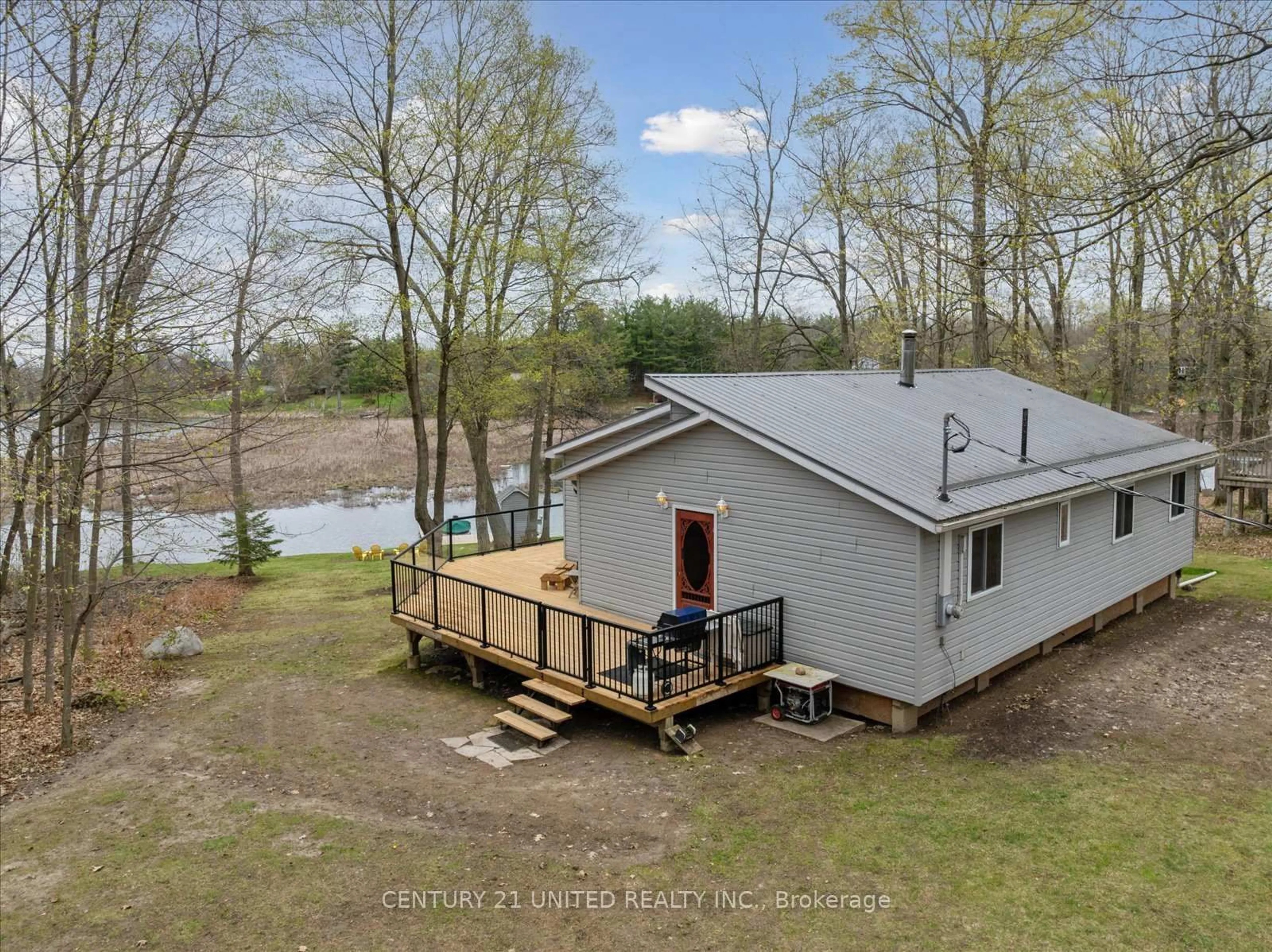 A pic from outside/outdoor area/front of a property/back of a property/a pic from drone, water/lake/river/ocean view for 179 Long Island, Otonabee-South Monaghan Ontario K0L 2G0