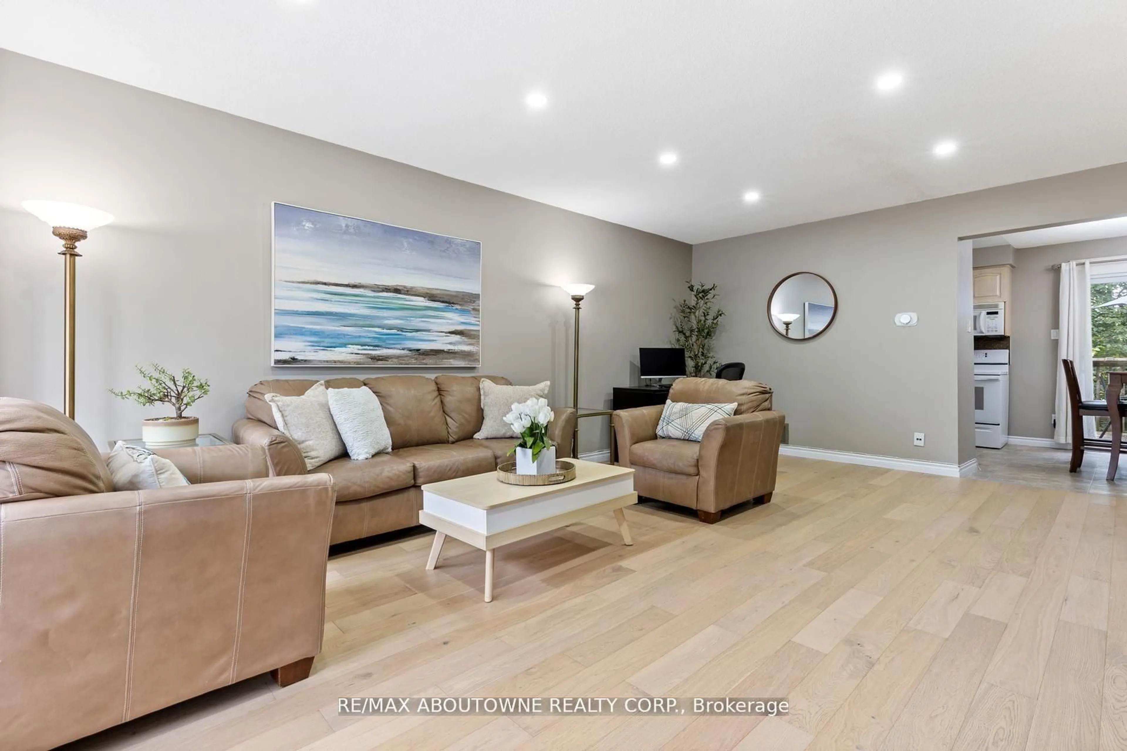 Living room with furniture, wood/laminate floor for 49 Cedarwoods Cres #48, Kitchener Ontario N2C 2L1