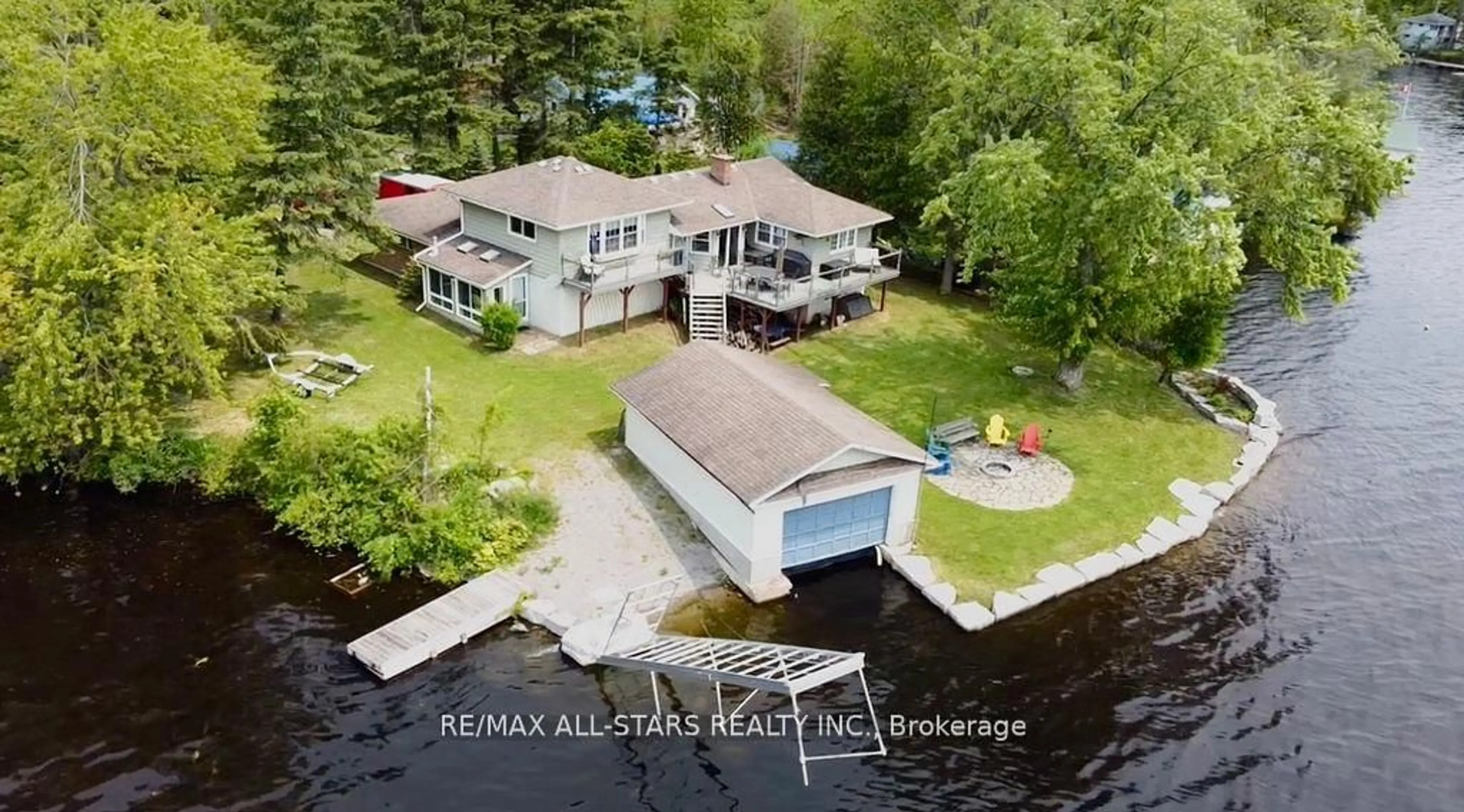 A pic from outside/outdoor area/front of a property/back of a property/a pic from drone, water/lake/river/ocean view for 11 Fire Route 94A Rte, Trent Lakes Ontario K0M 1A0