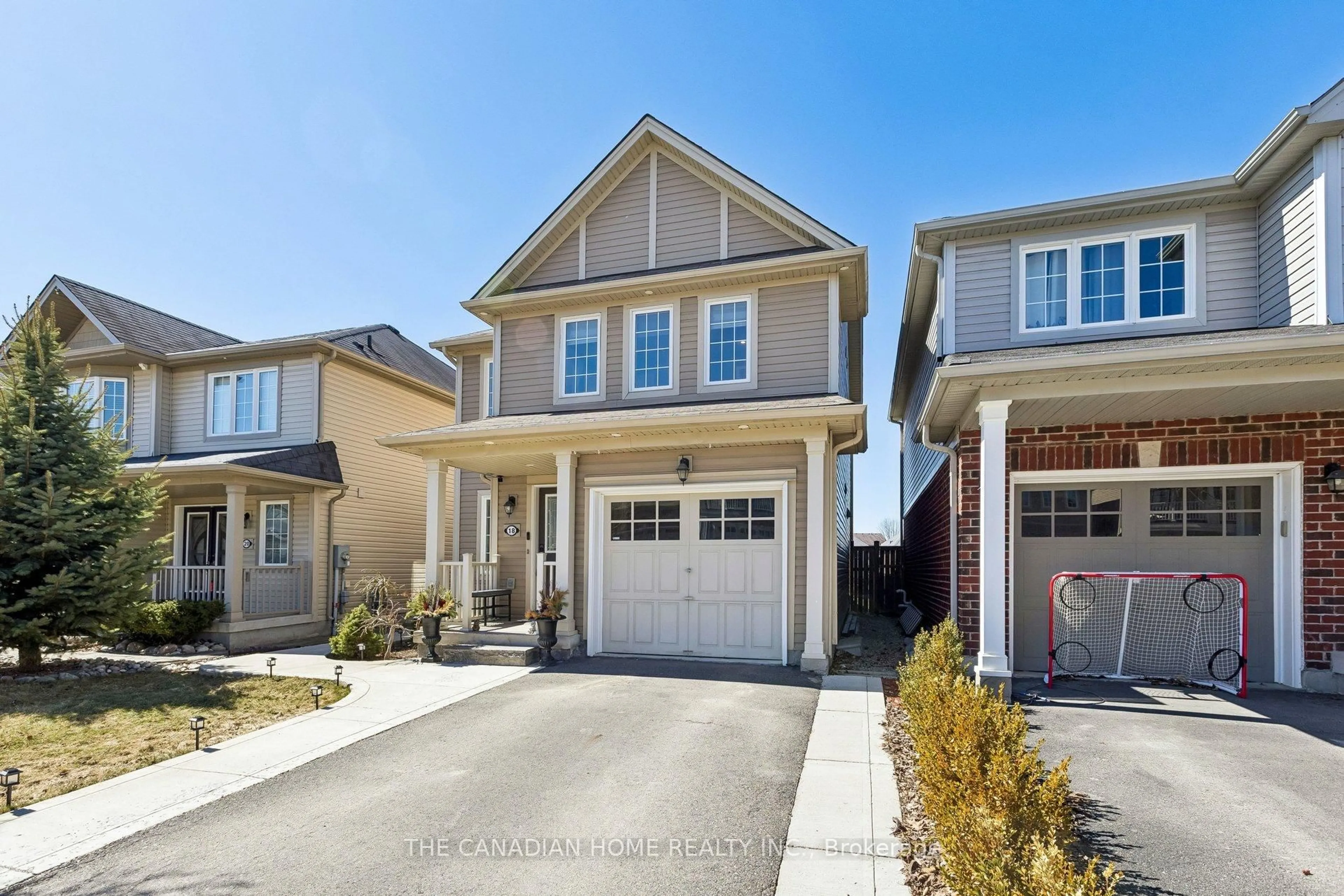 Home with vinyl exterior material, street for 18 Merritt Lane, Brantford Ontario N3T 0E8