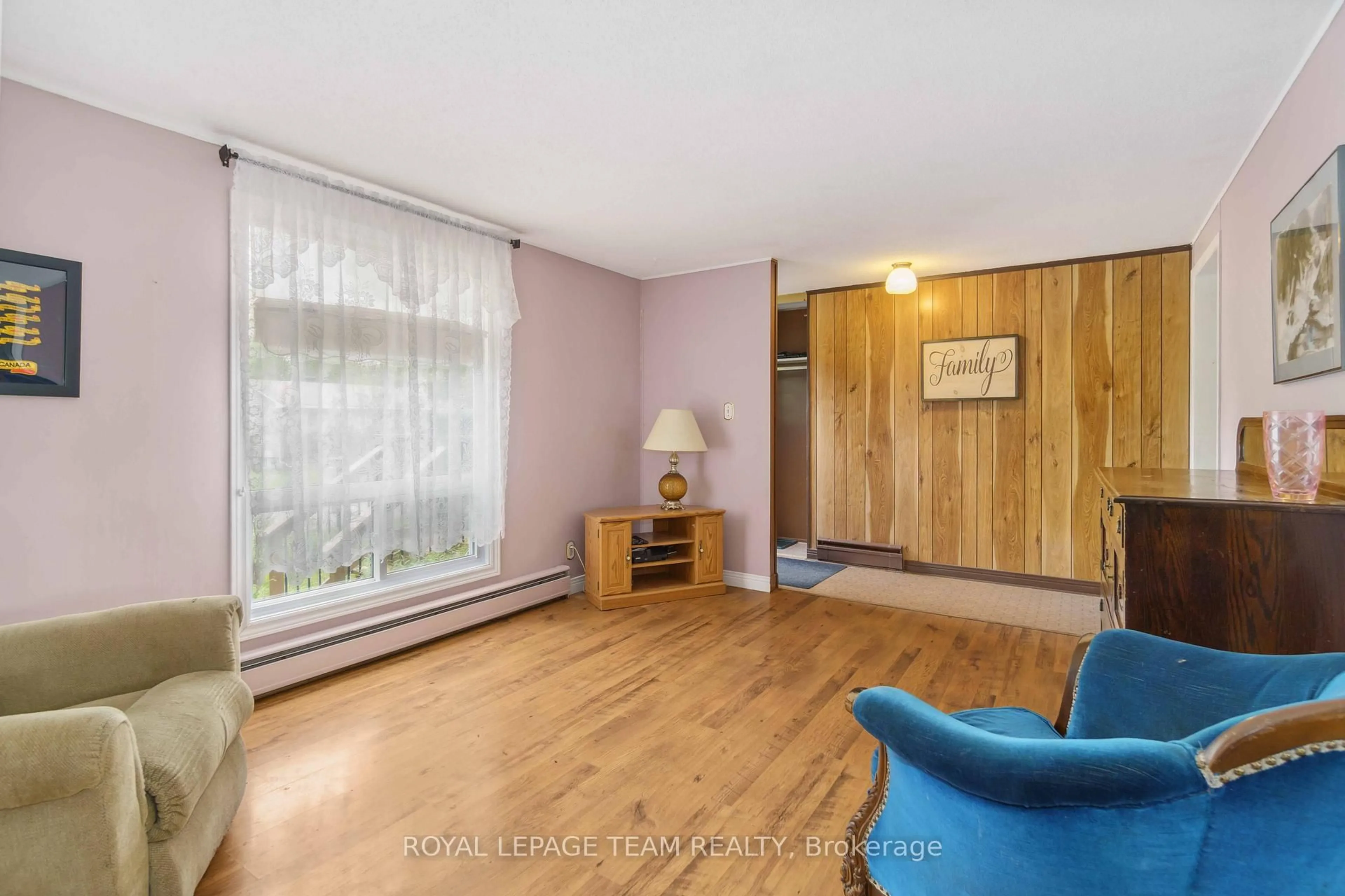 Living room with furniture, wood/laminate floor for 307 Dodson St, North Grenville Ontario K0G 1J0