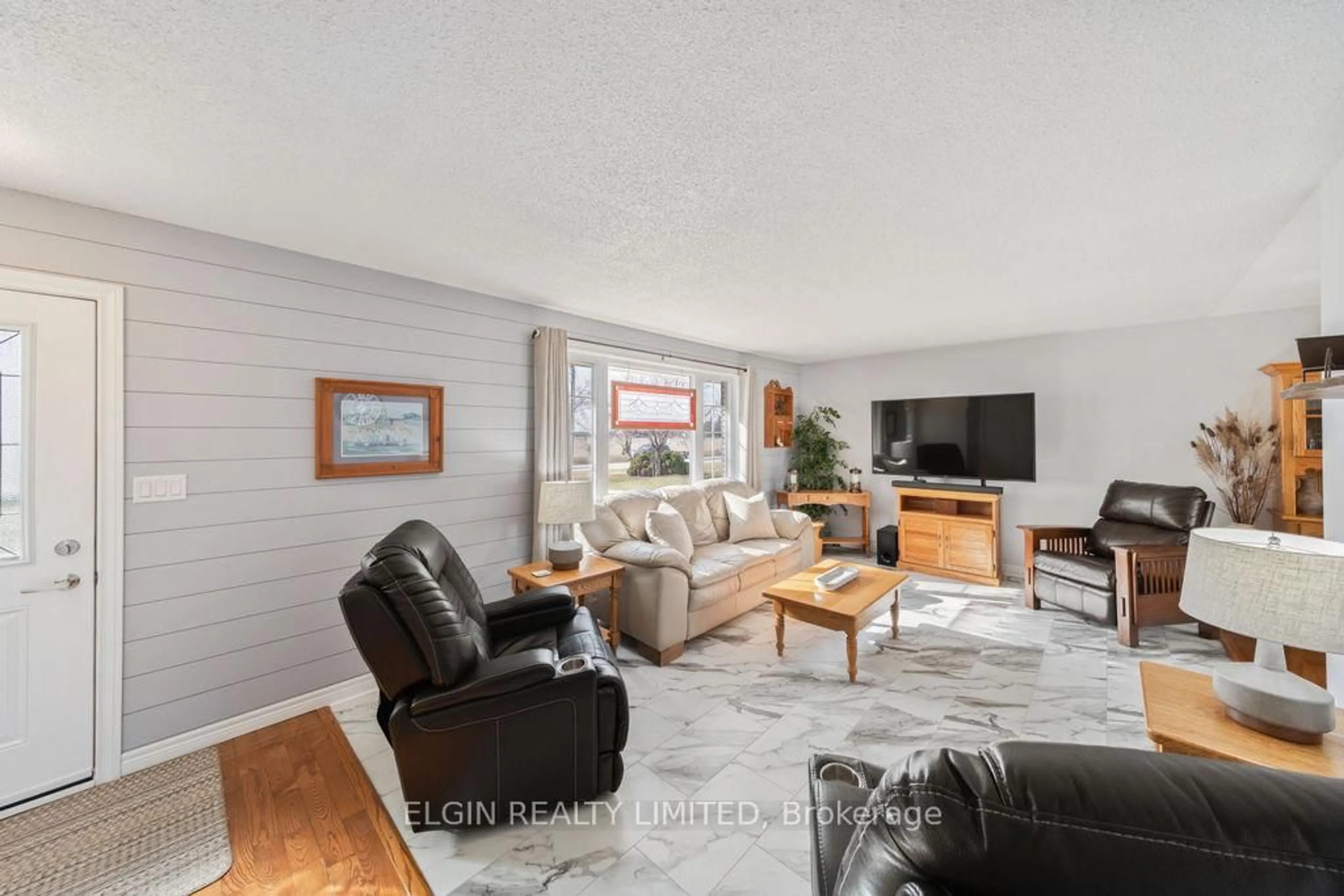 Living room with furniture, wood/laminate floor for 3134 Queen St, Brooke-Alvinston Ontario N0N 1K0