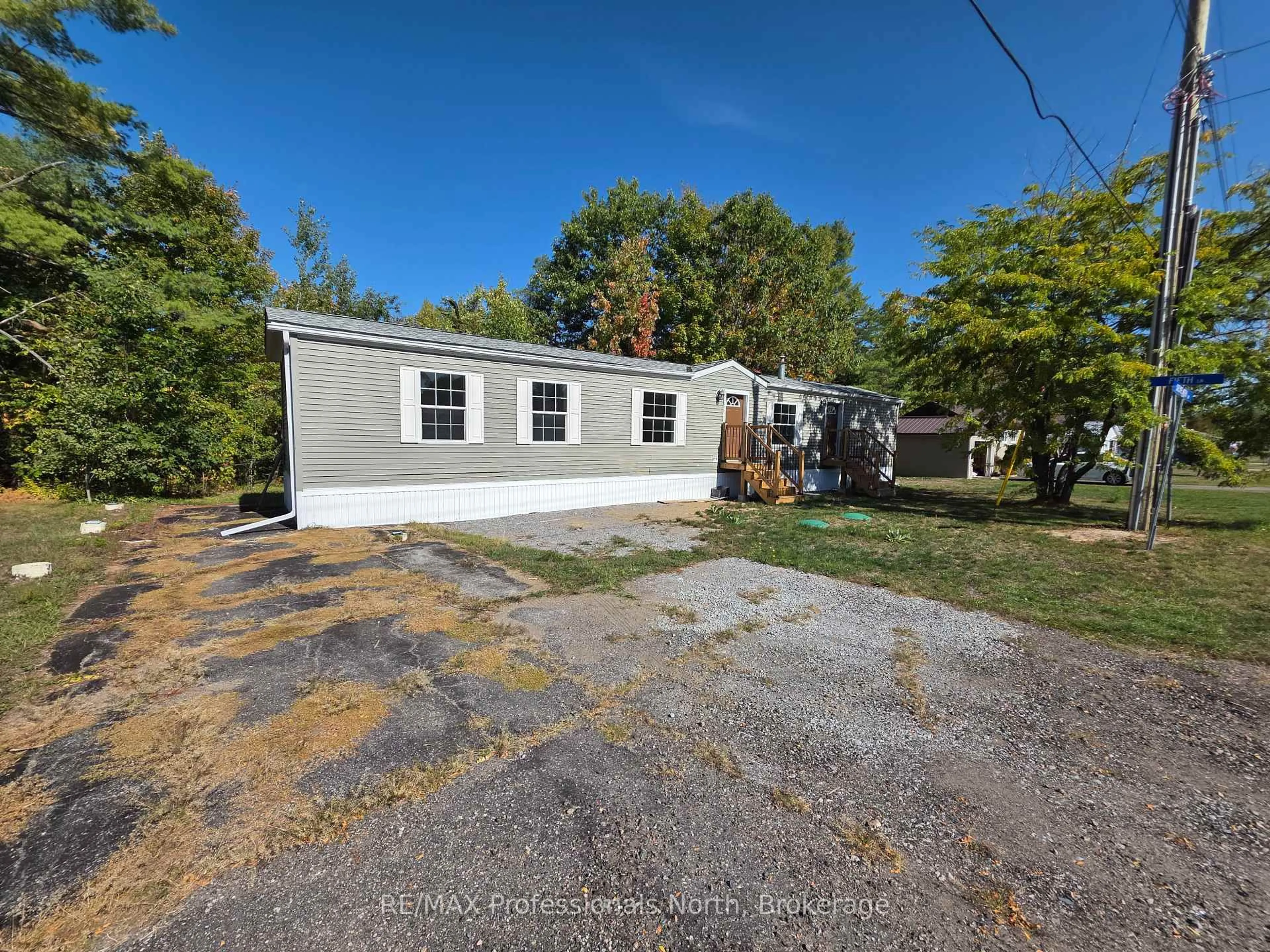 A pic from outside/outdoor area/front of a property/back of a property/a pic from drone, street for 1013 Seventh Lane, Minden Hills Ontario K0M 2K0
