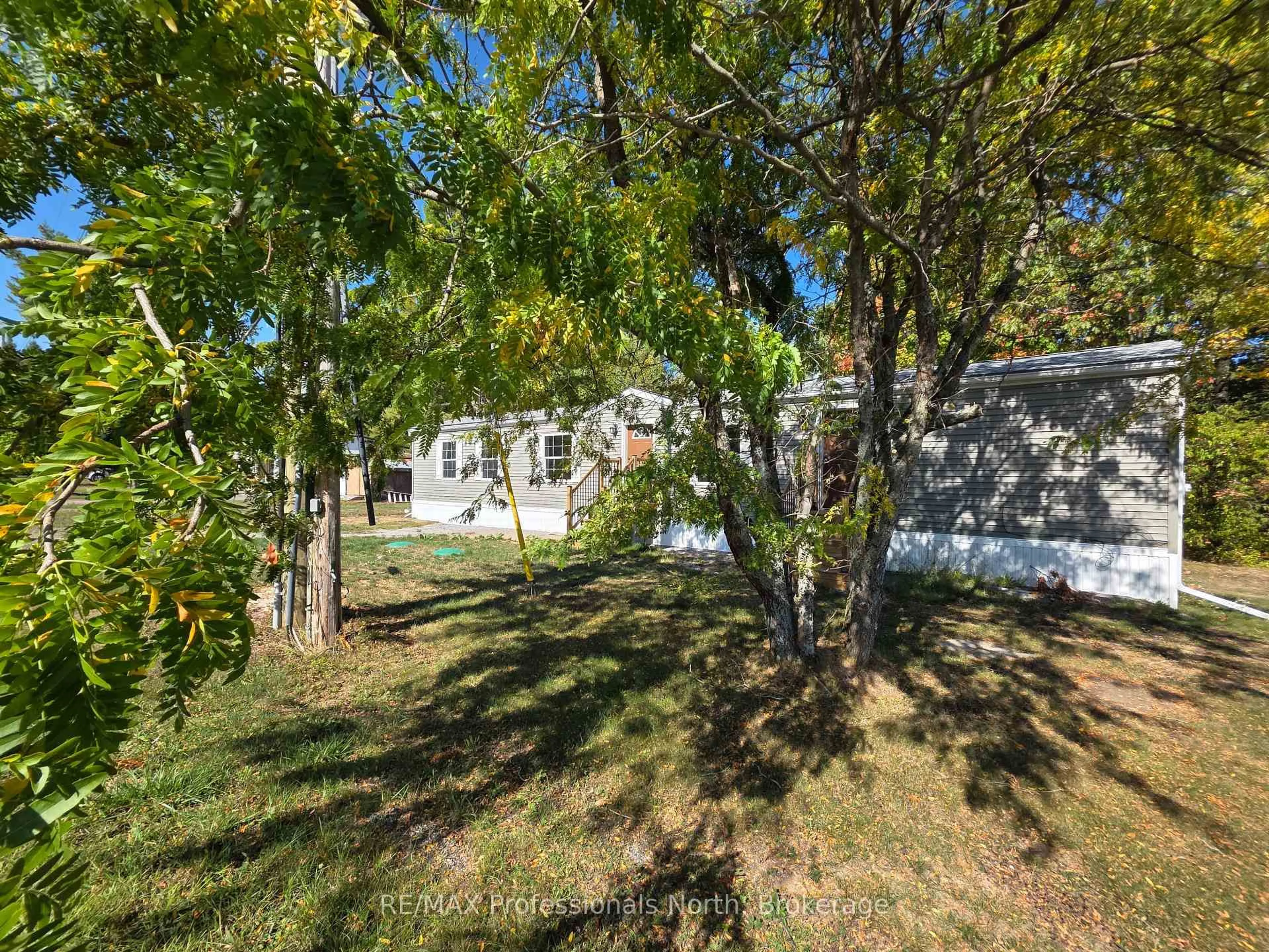 A pic from outside/outdoor area/front of a property/back of a property/a pic from drone, forest/trees view for 1013 Seventh Lane, Minden Hills Ontario K0M 2K0