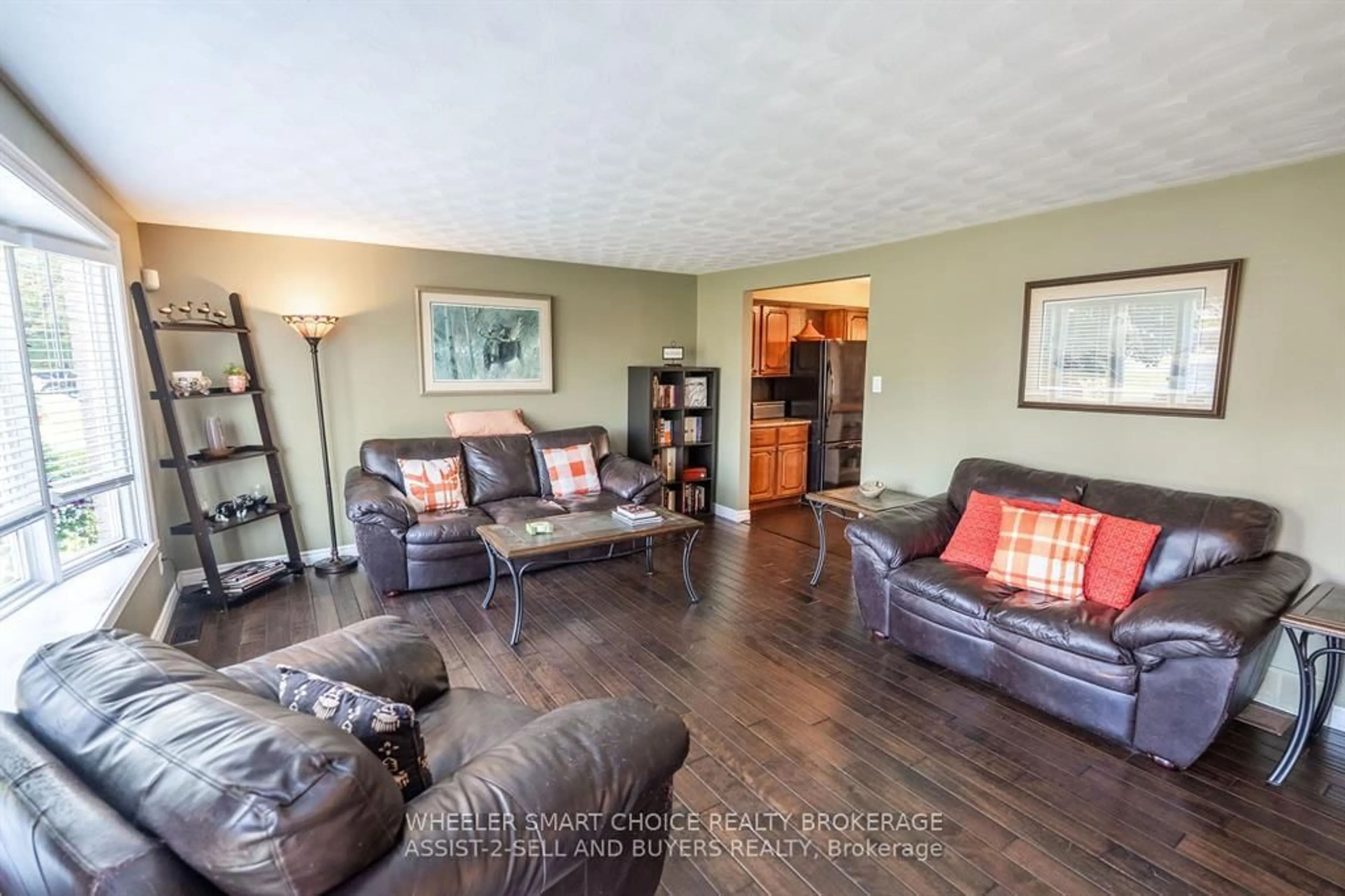 Living room with furniture, wood/laminate floor for 17407 County Rd 18 Rd, South Stormont Ontario K0C 2A0