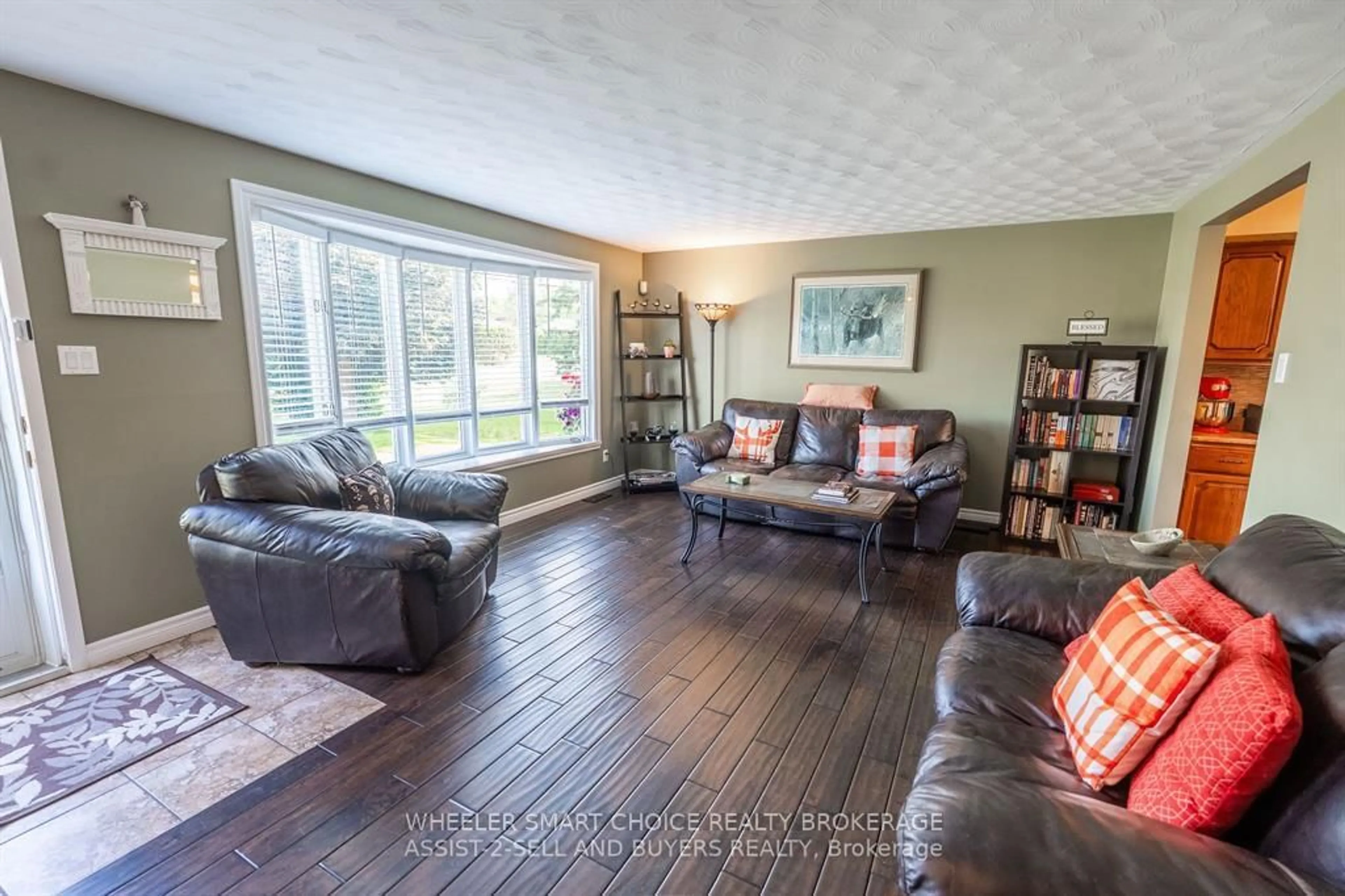Living room with furniture, wood/laminate floor for 17407 County Rd 18 Rd, South Stormont Ontario K0C 2A0
