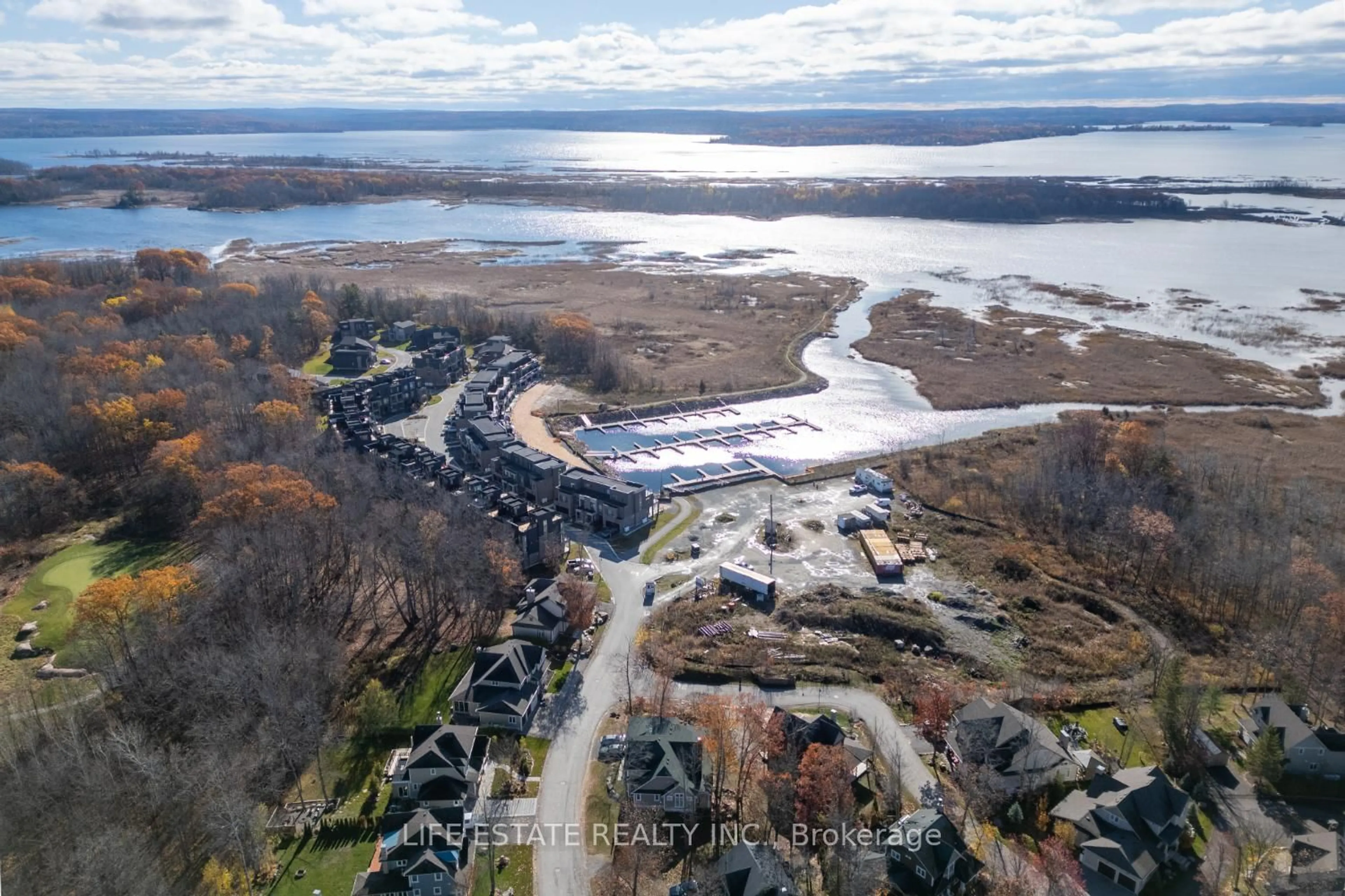 A pic from outside/outdoor area/front of a property/back of a property/a pic from drone, water/lake/river/ocean view for 39 Country Tr #20, Georgian Bay Ontario L0K 1S0