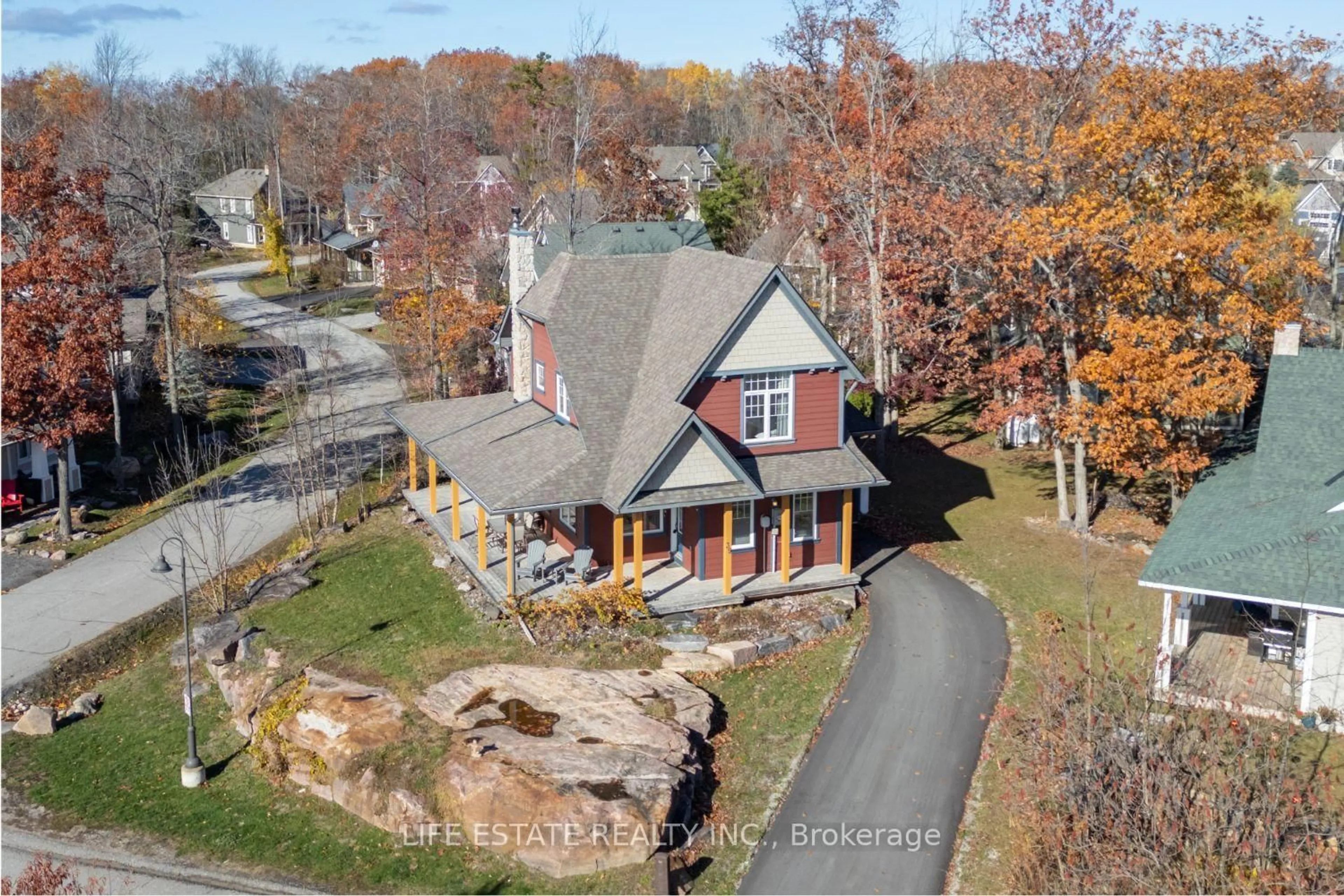 A pic from outside/outdoor area/front of a property/back of a property/a pic from drone, street for 39 Country Tr #20, Georgian Bay Ontario L0K 1S0