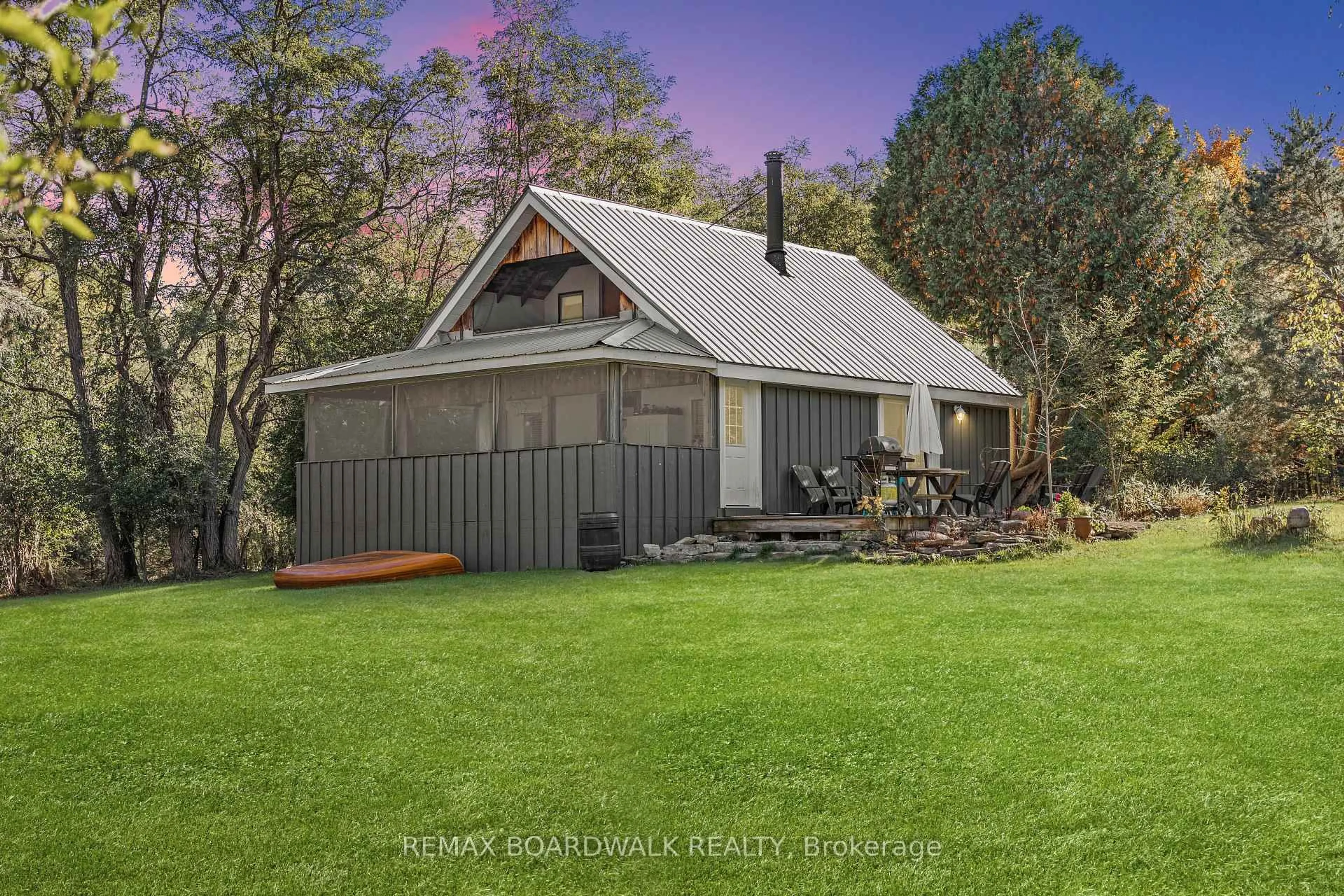 A pic from outside/outdoor area/front of a property/back of a property/a pic from drone, street for 402 Mp4 Rd, Rideau Lakes Ontario K0G 1V0