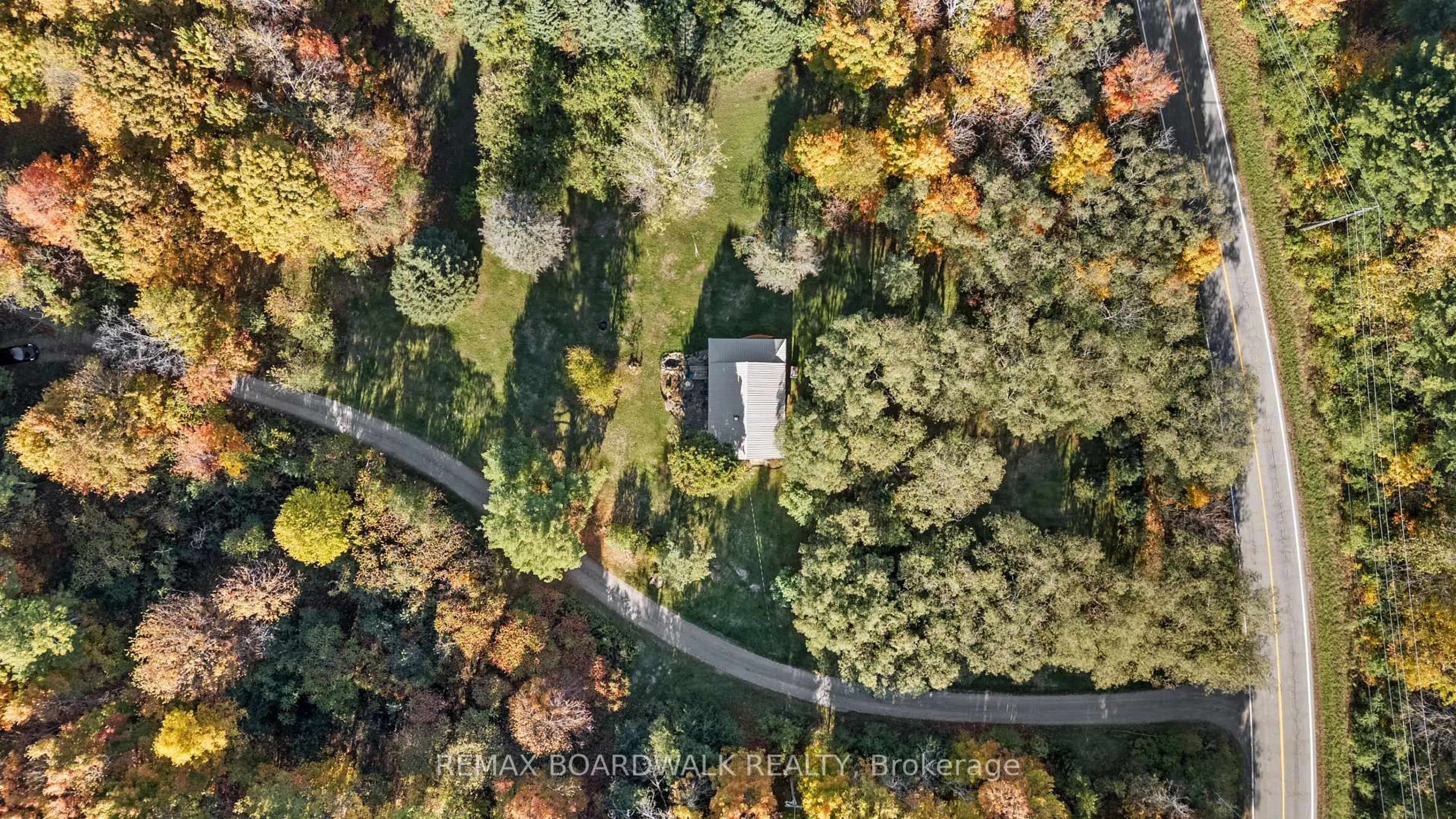 A pic from outside/outdoor area/front of a property/back of a property/a pic from drone, forest/trees view for 402 Mp4 Rd, Rideau Lakes Ontario K0G 1V0