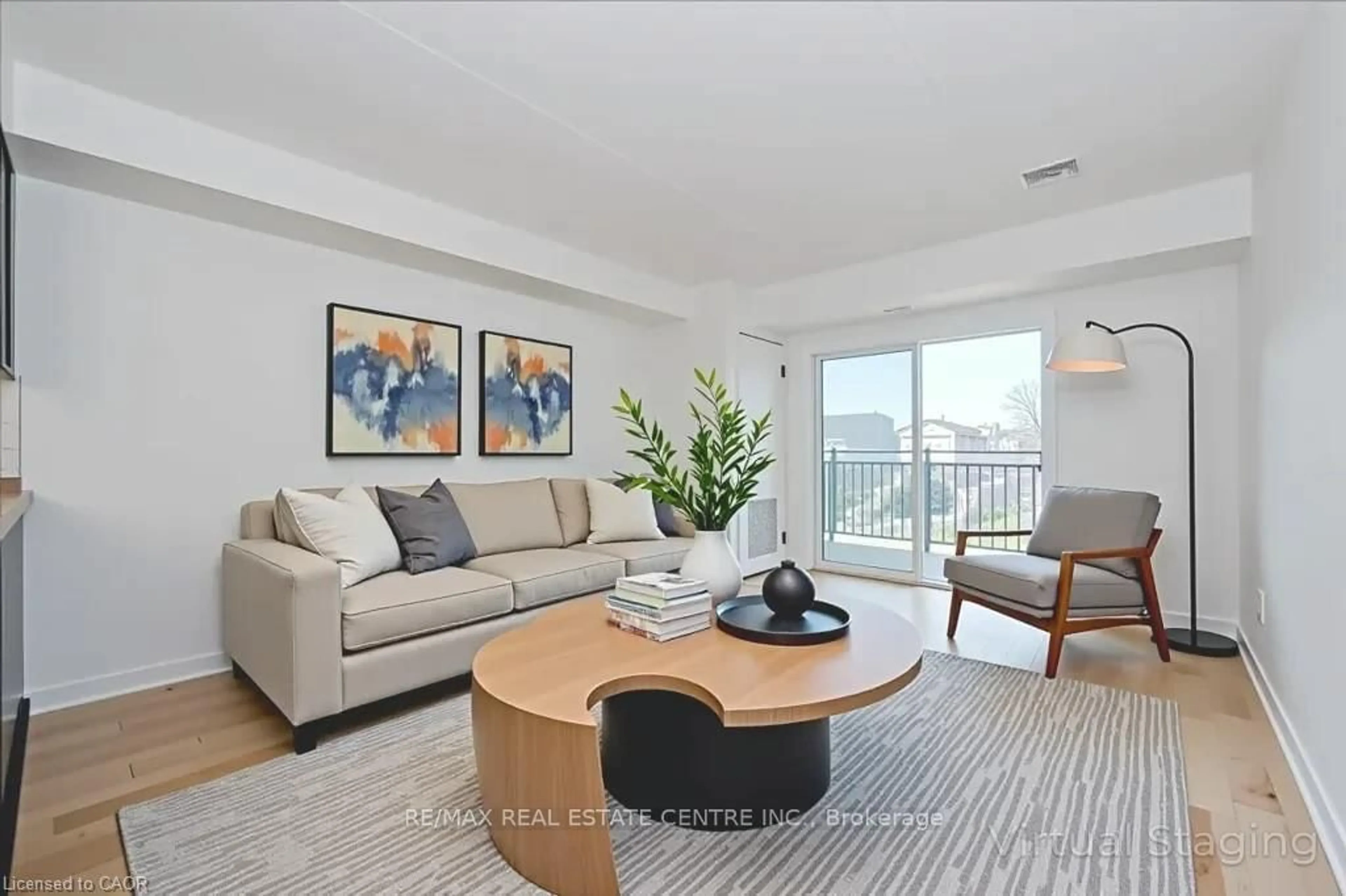 Living room with furniture, unknown for 41 Goodwin Dr #202, Guelph Ontario N1L 0E7