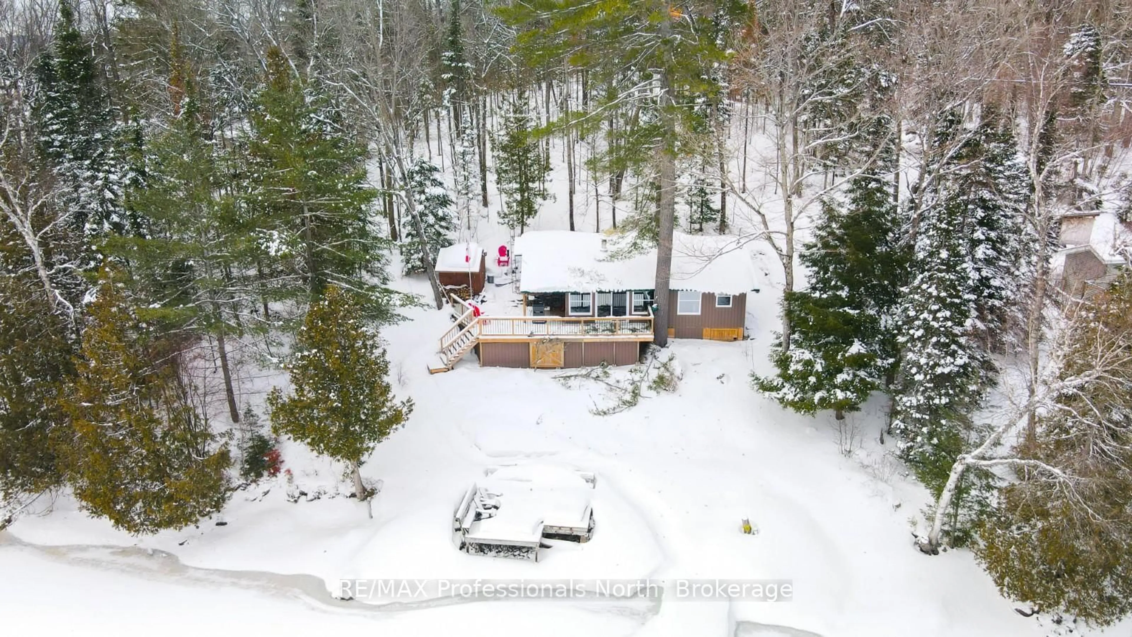 A pic from outside/outdoor area/front of a property/back of a property/a pic from drone, forest/trees view for 1027 Dow Tr, Dysart et al Ontario K0M 1S0