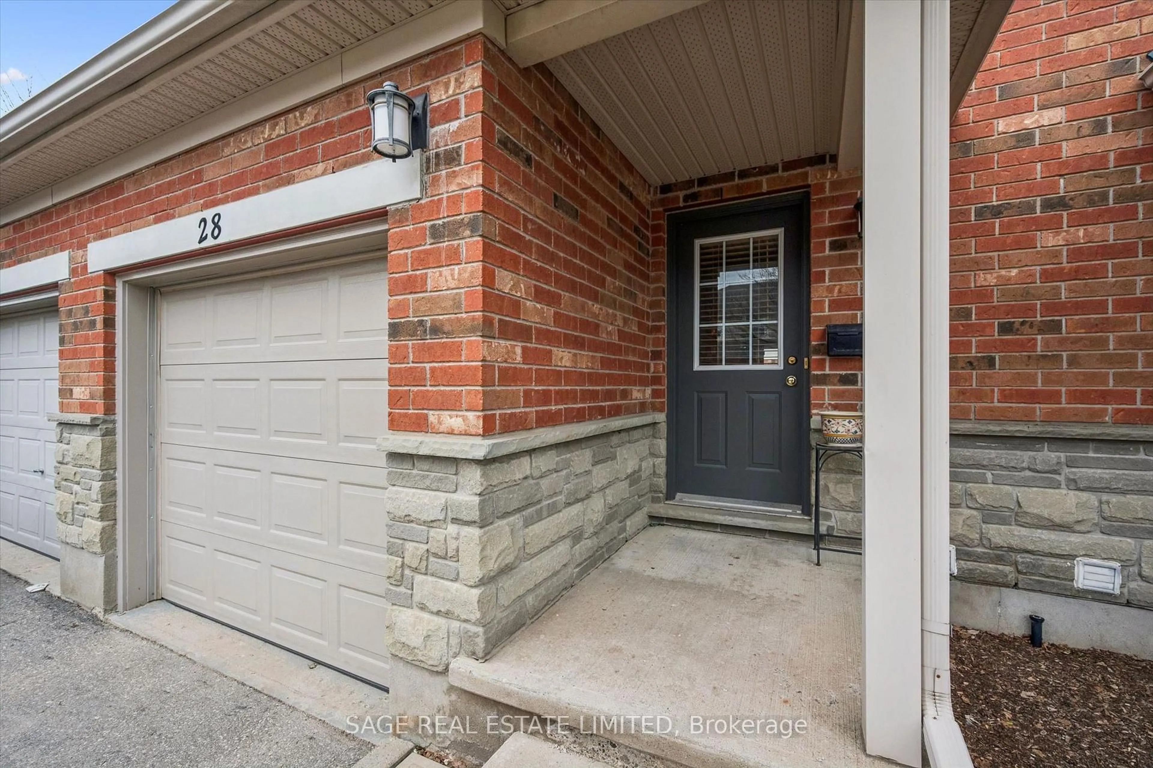 Home with brick exterior material, street for 124 GOSLING Gdns #28, Guelph Ontario N1G 5K6