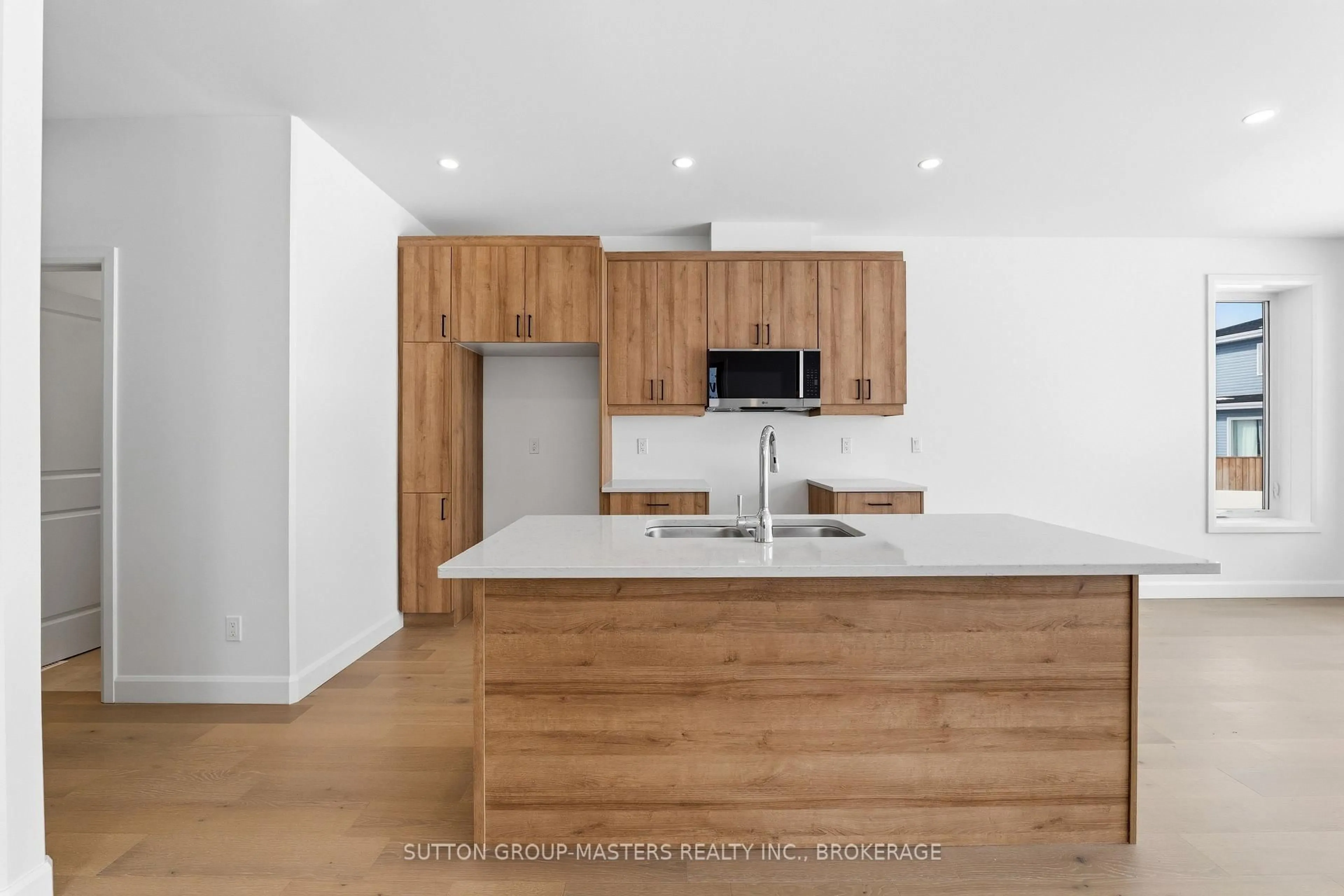 Open concept kitchen, wood/laminate floor for 218 Superior Dr, Loyalist Ontario K7N 0G1