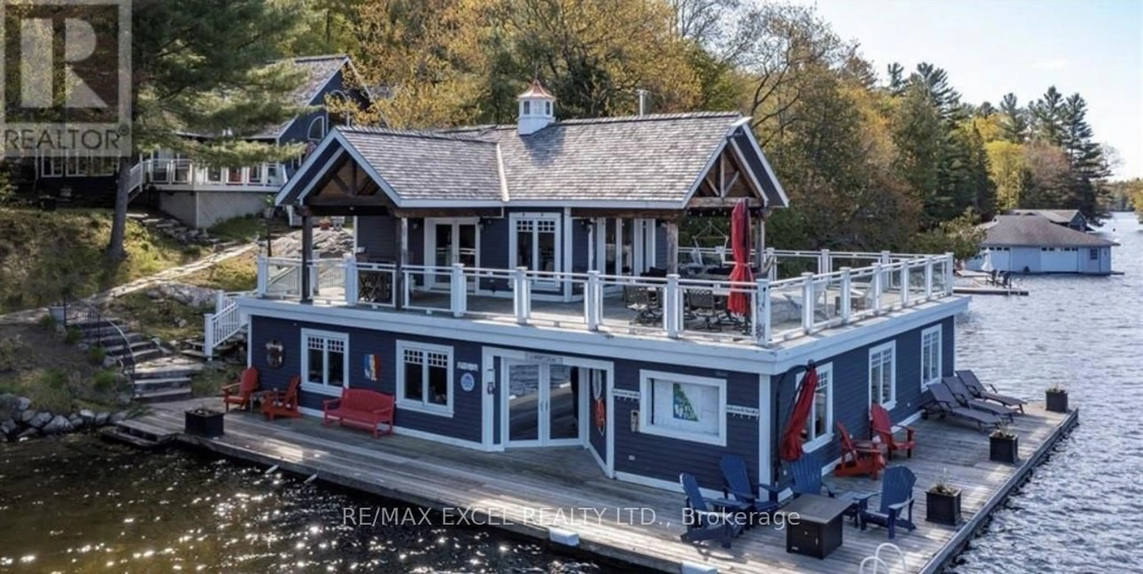 A pic from outside/outdoor area/front of a property/back of a property/a pic from drone, water/lake/river/ocean view for 1205 Joe River Rd #2, Muskoka Lakes Ontario P0C 1J0