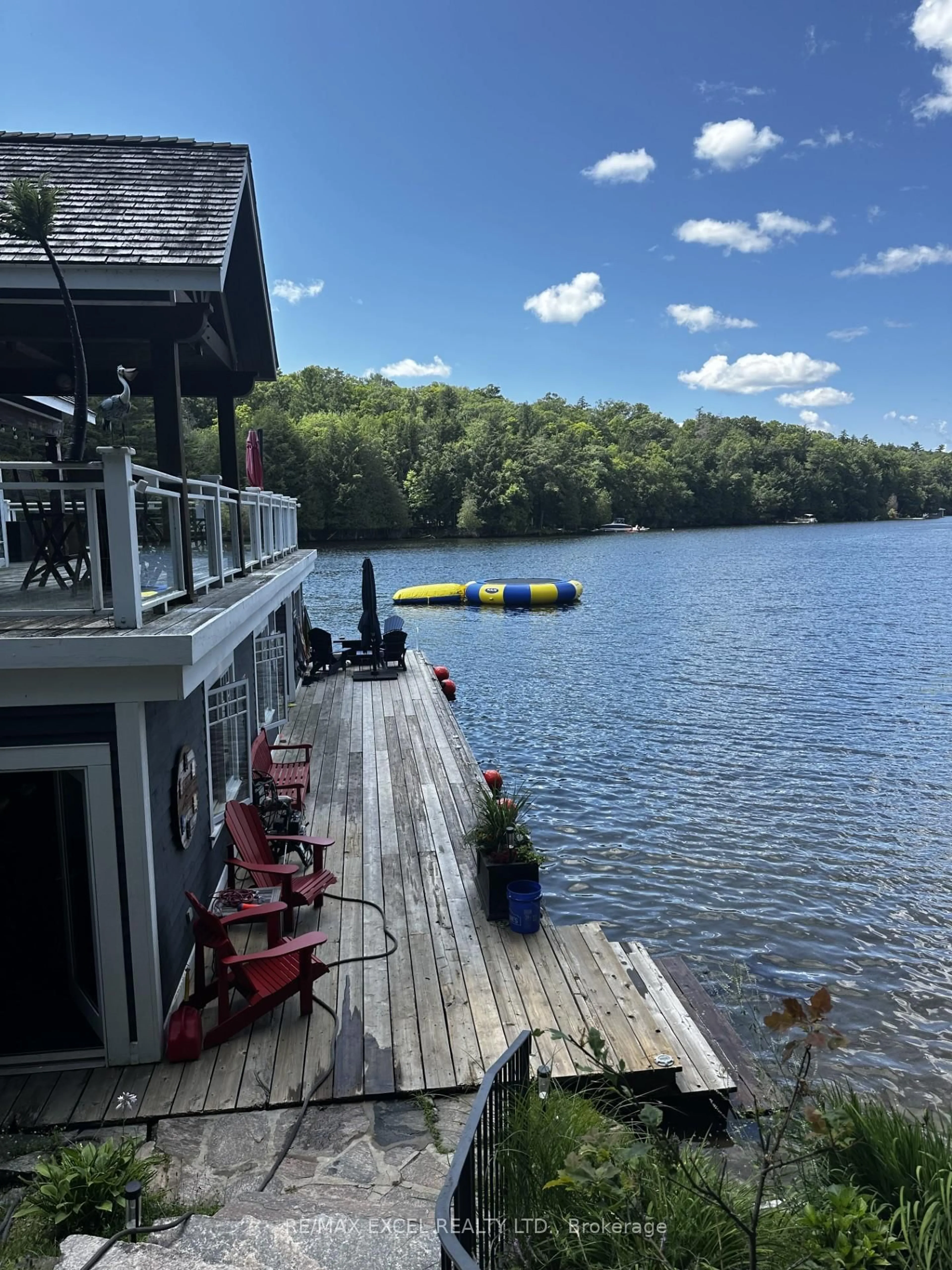 A pic from outside/outdoor area/front of a property/back of a property/a pic from drone, water/lake/river/ocean view for 1205 Joe River Rd #2, Muskoka Lakes Ontario P0C 1J0