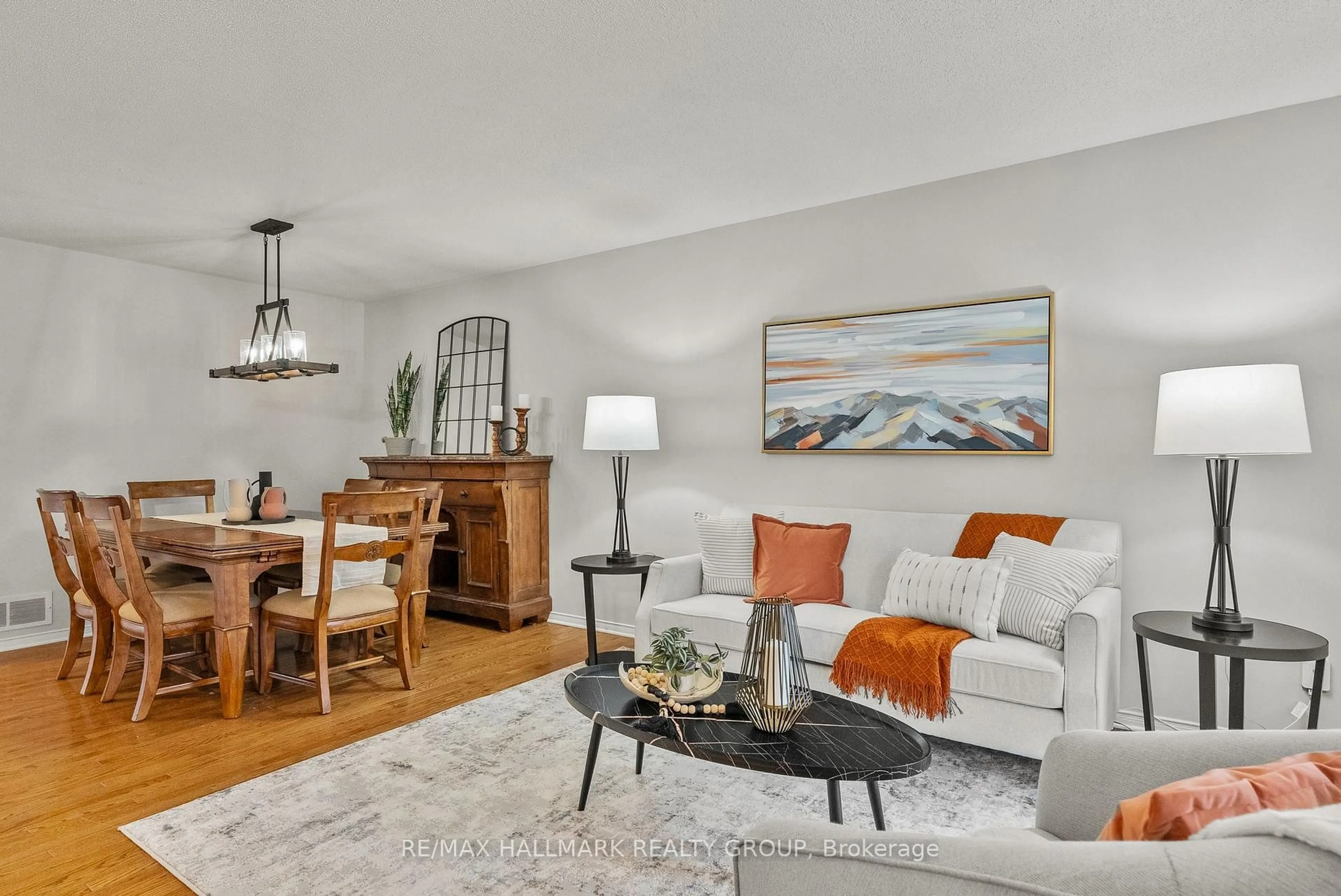 Living room with furniture, wood/laminate floor for 18 Irish Rose Cres, Ottawa Ontario K2J 4T7