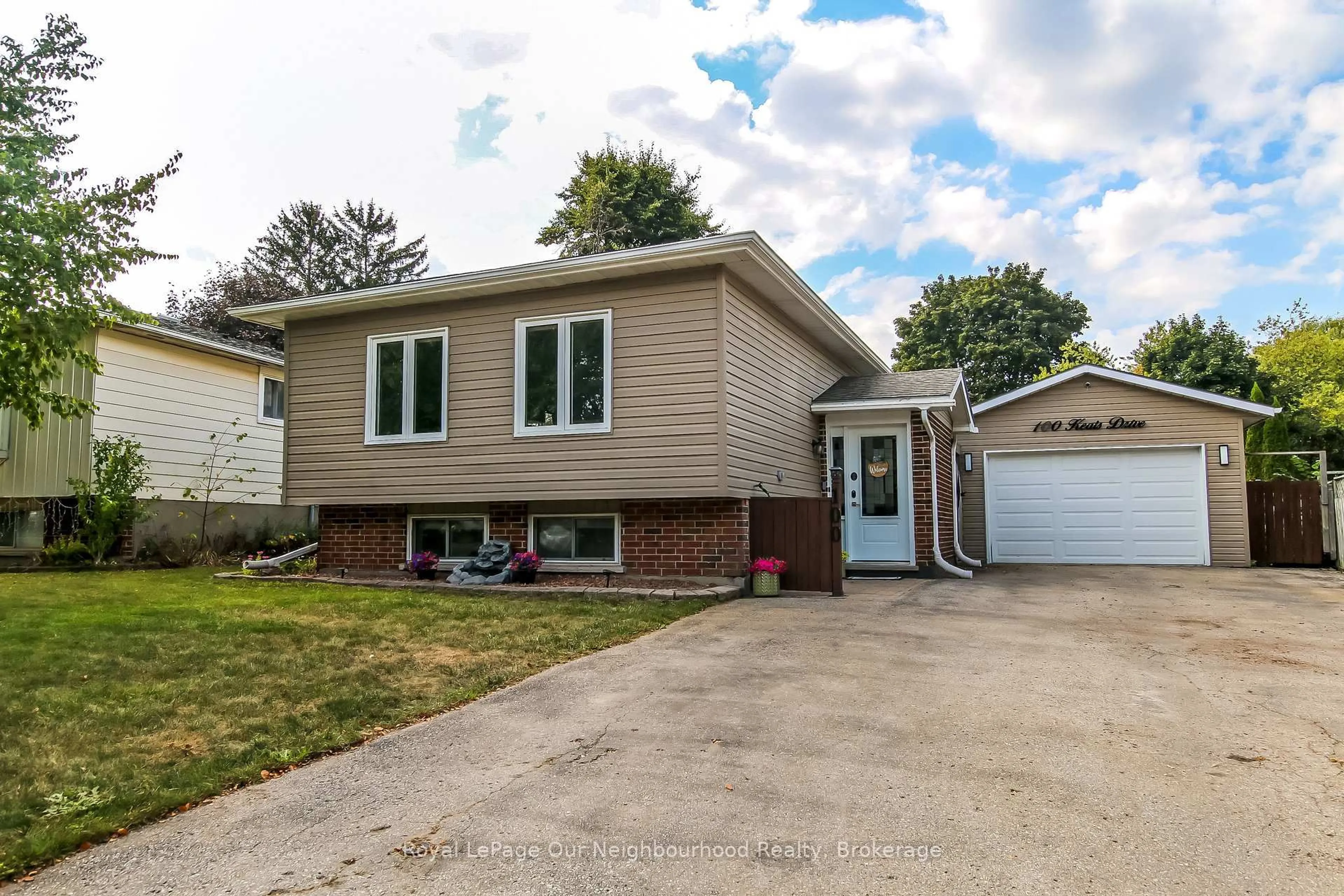 Home with vinyl exterior material, street for 100 Keats Dr, Woodstock Ontario N4S 8B8