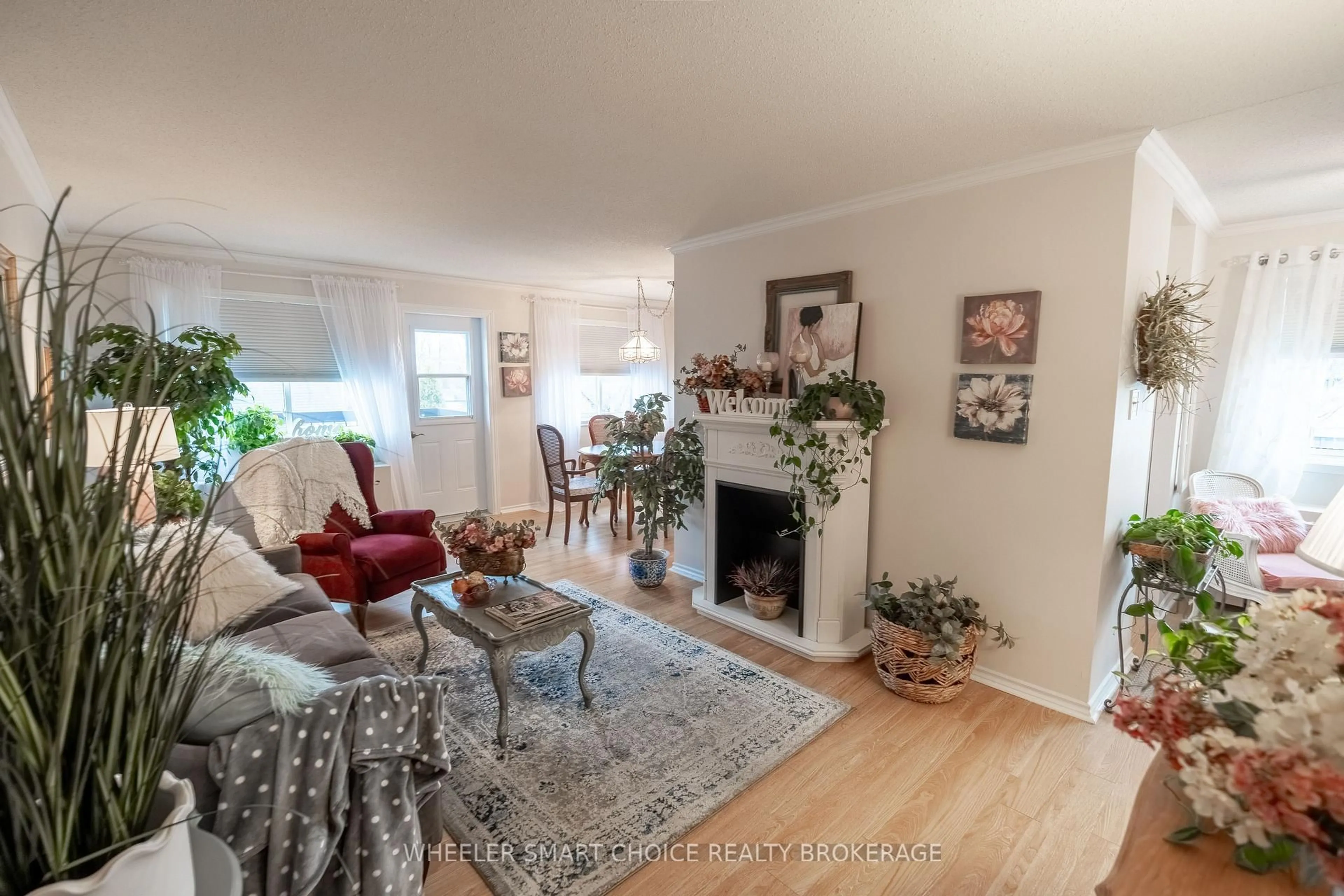 Living room with furniture, wood/laminate floor for 118 Fourth St #405, Cornwall Ontario K6H 2H9