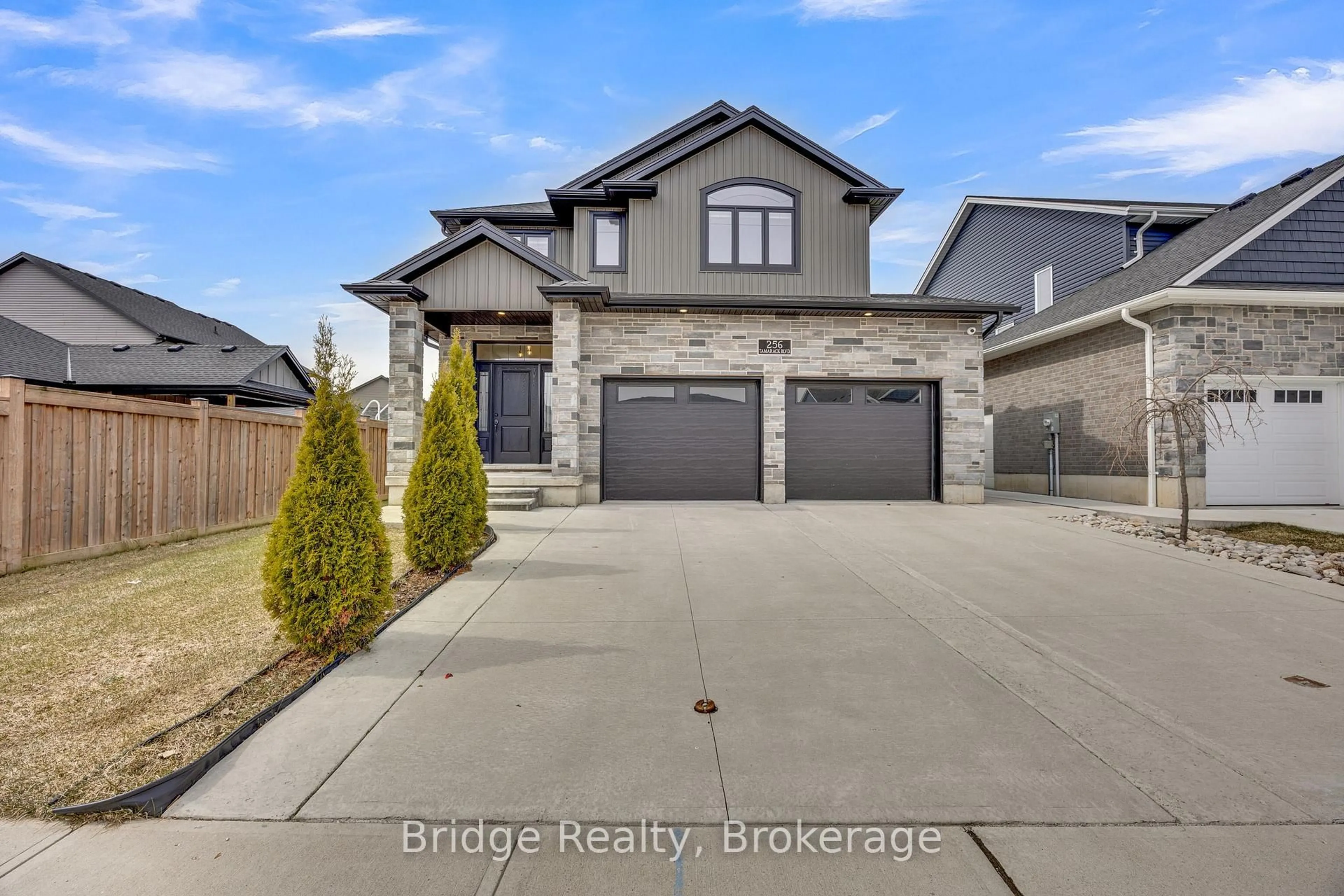 Home with brick exterior material, street for 256 Tamarack Blvd, Woodstock Ontario N4S 0E2