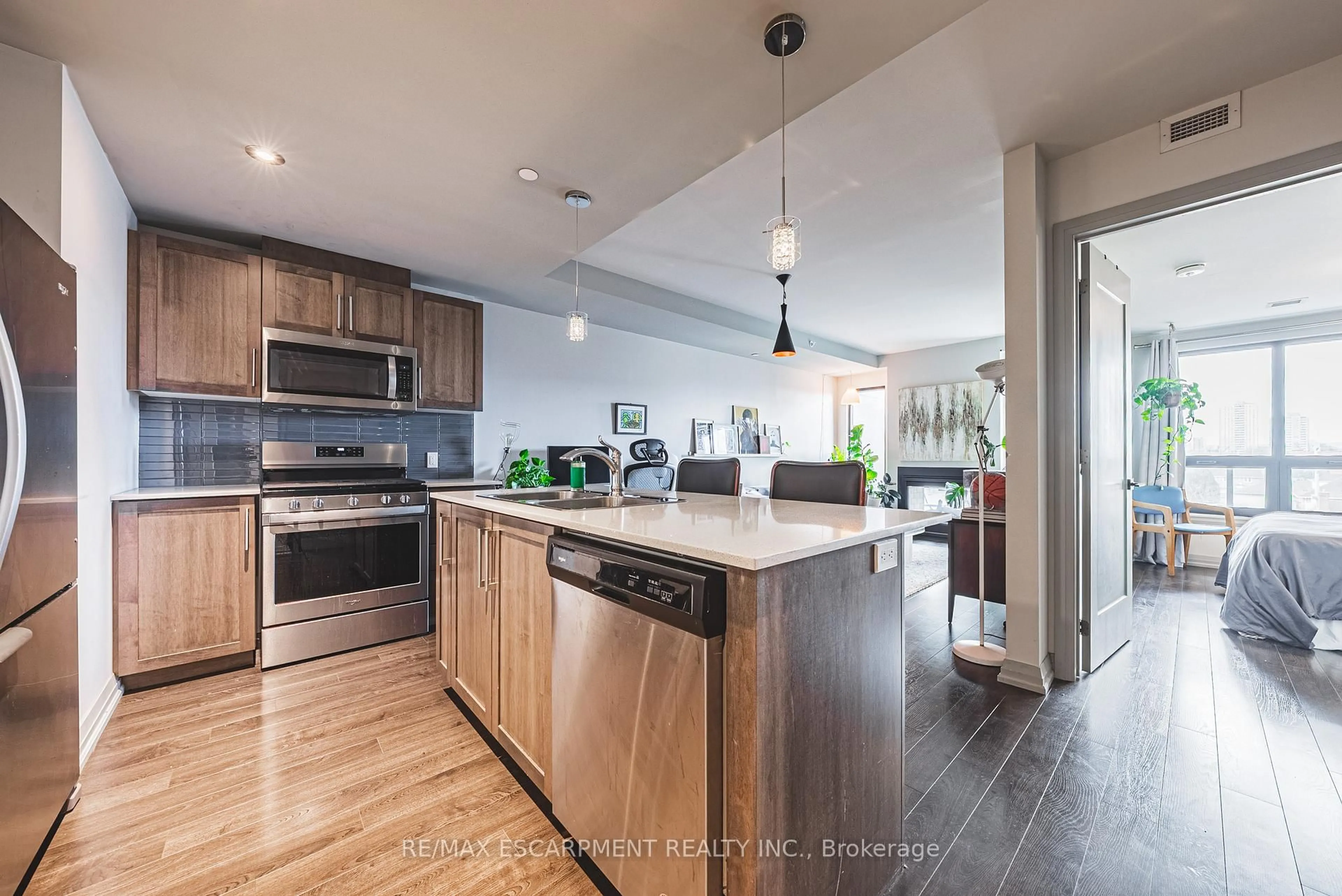 Open concept kitchen, wood/laminate floor for 181 James St #503, Hamilton Ontario L8R 2K9