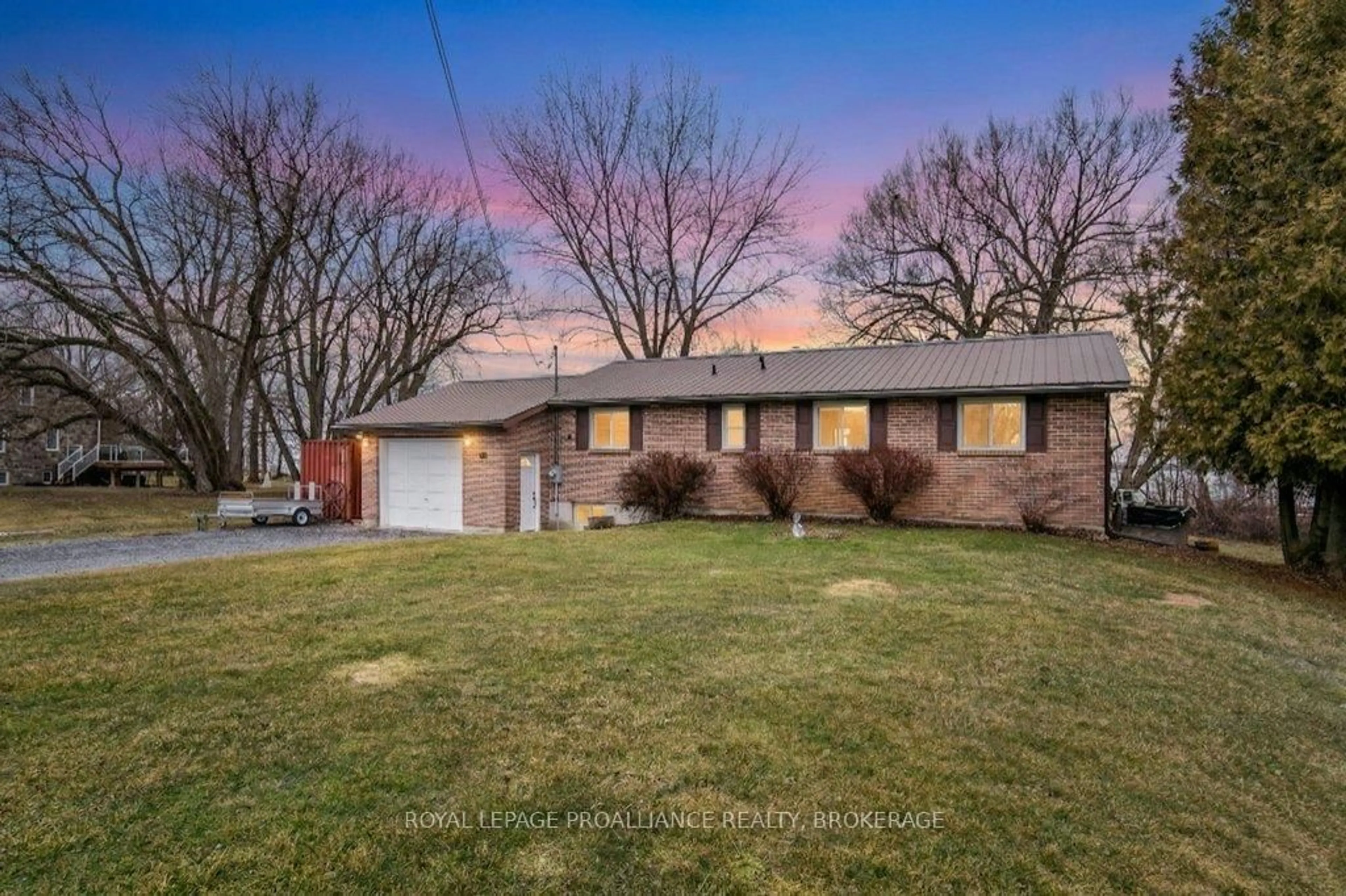 A pic from outside/outdoor area/front of a property/back of a property/a pic from drone, street for 306 Easy Lane, Wolfe Island Ontario K0H 2Y0
