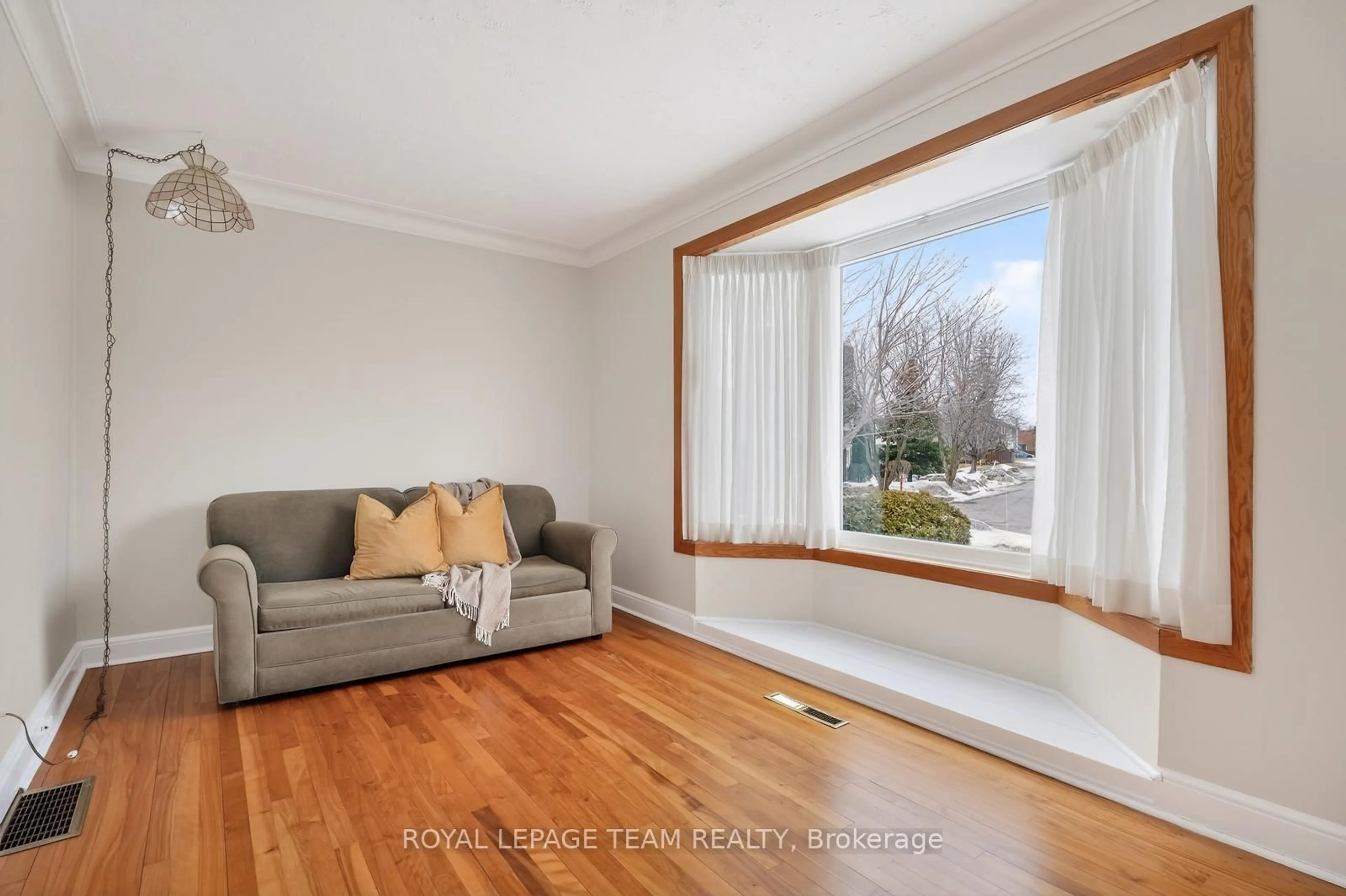 Living room with furniture, wood/laminate floor for 336 Ducharme Blvd, Ottawa Ontario K1L 6T6